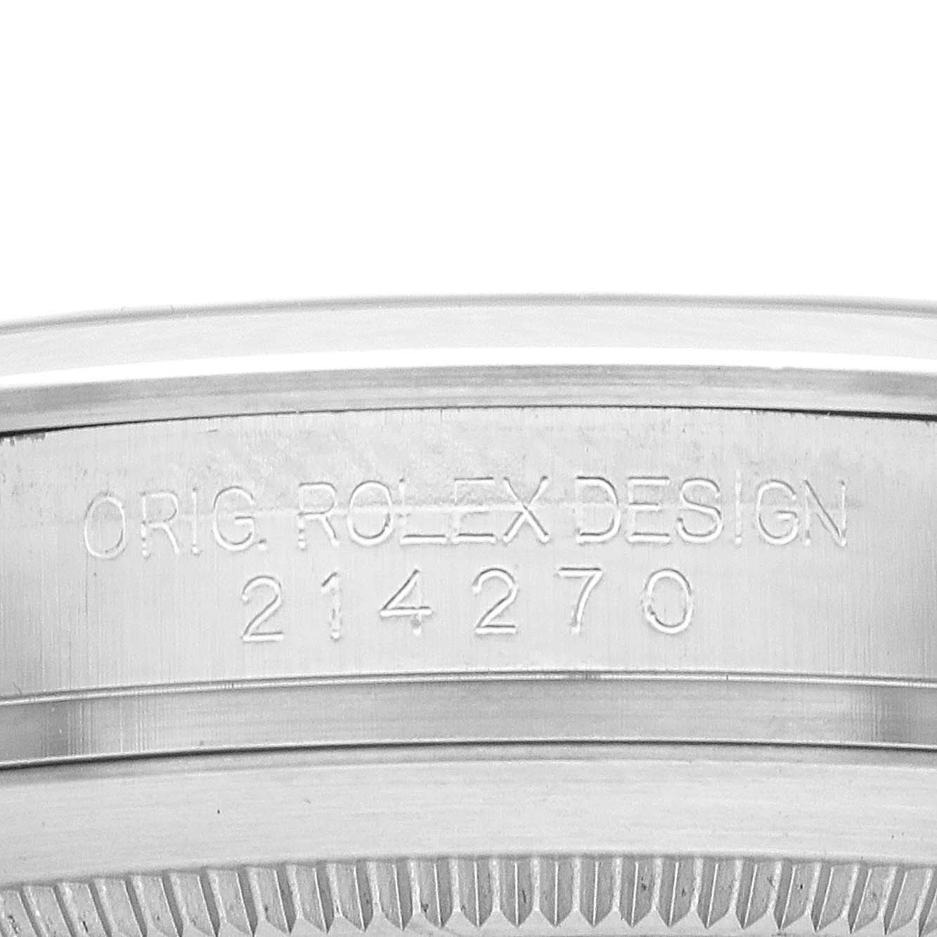 The image shows the side of a Rolex Explorer 214270 Men
s Stainless Steel Black Dial model, focusing on the engraved serial number and "ORIG. ROLEX DESIGN."