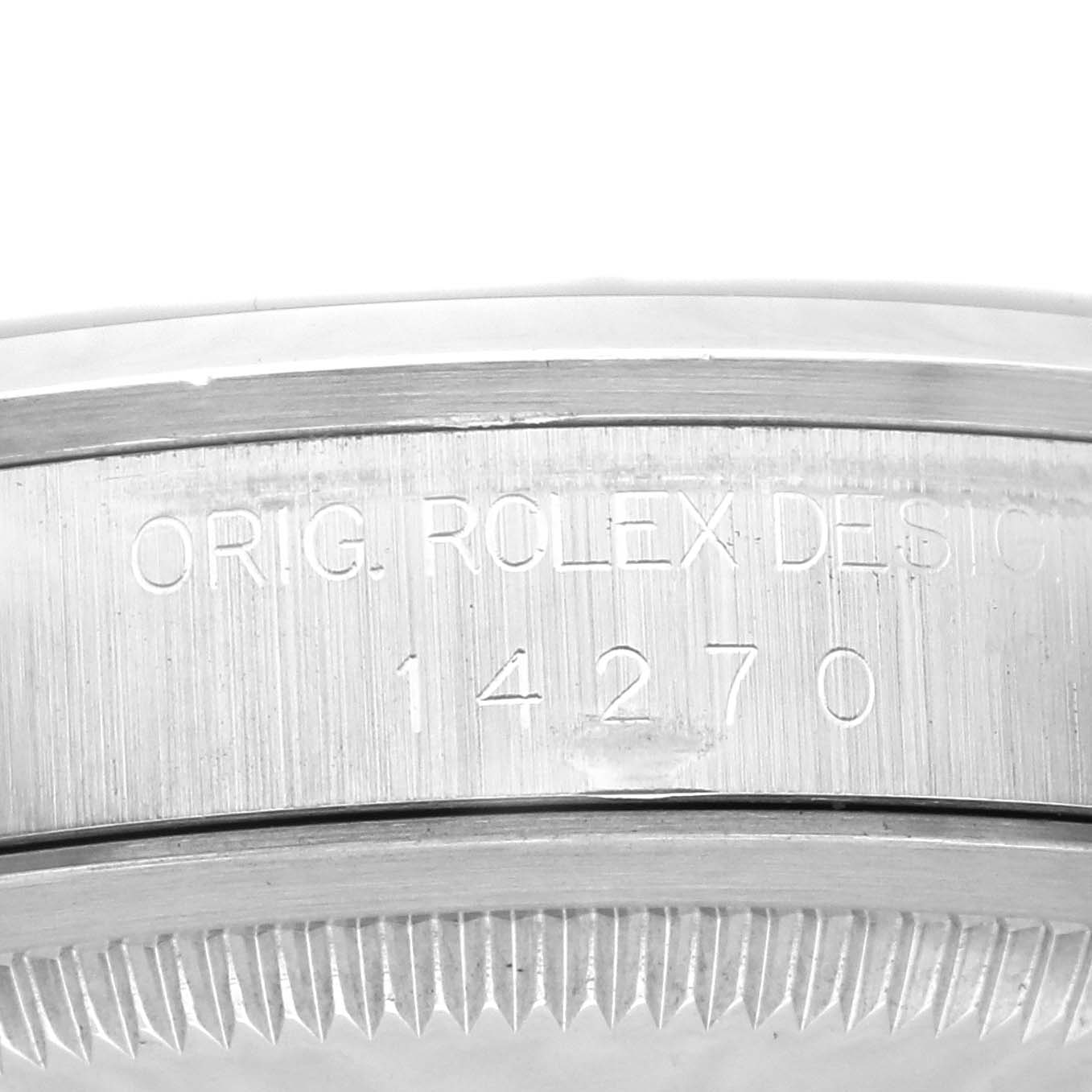 This image shows a close-up of the side case and bezel of the Rolex Explorer 14270 Men
s Stainless Steel Black Dial 14270 Men
s Stainless Steel Black Dial model 14270, revealing the engraved design numbers.