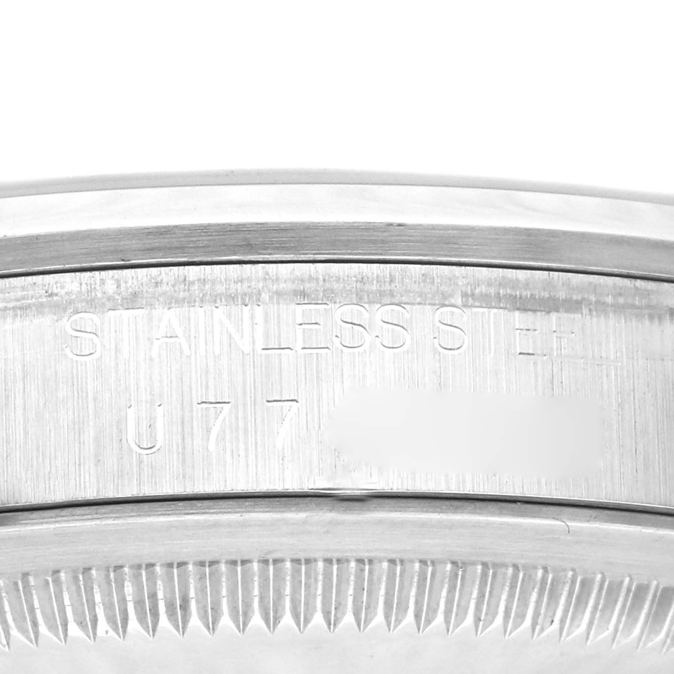 This image shows a close-up of the engraved serial number on the case back of a Rolex Explorer 14270 Men
s Stainless Steel Black Dial 14270 Men
s Stainless Steel Black Dial watch.