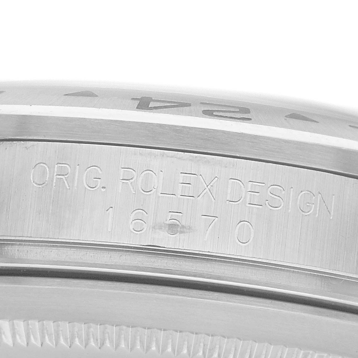 The image shows a close-up of the side engraving on a Rolex Explorer 16570 Men
s Stainless Steel Black Dial, showcasing the model number "16570" and design details.