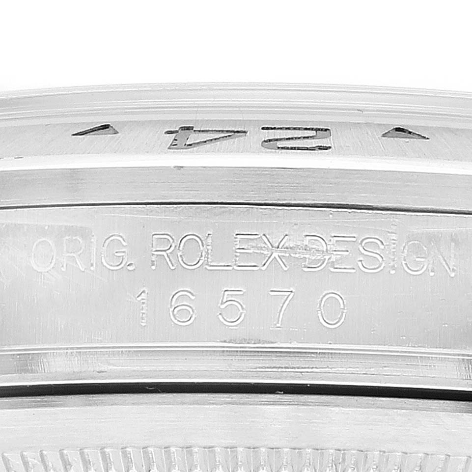 This image shows a close-up of the side bezel and engraving on a Rolex Explorer 16570 Men's Stainless Steel White Dial 16570 Men's Stainless Steel White Dial model 16570.