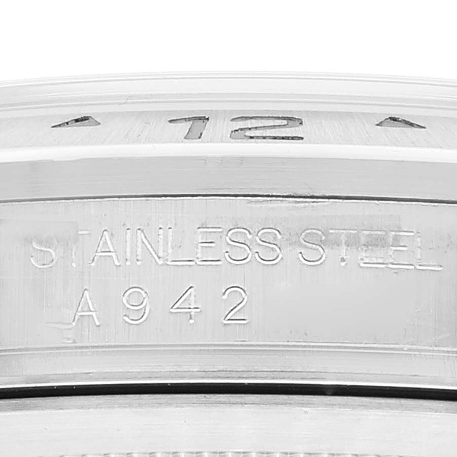 This is a close-up view of the side case, bezel, and engraved serial number of a Rolex Explorer 16570 Men's Stainless Steel White Dial 16570 Men's Stainless Steel White Dial model watch.