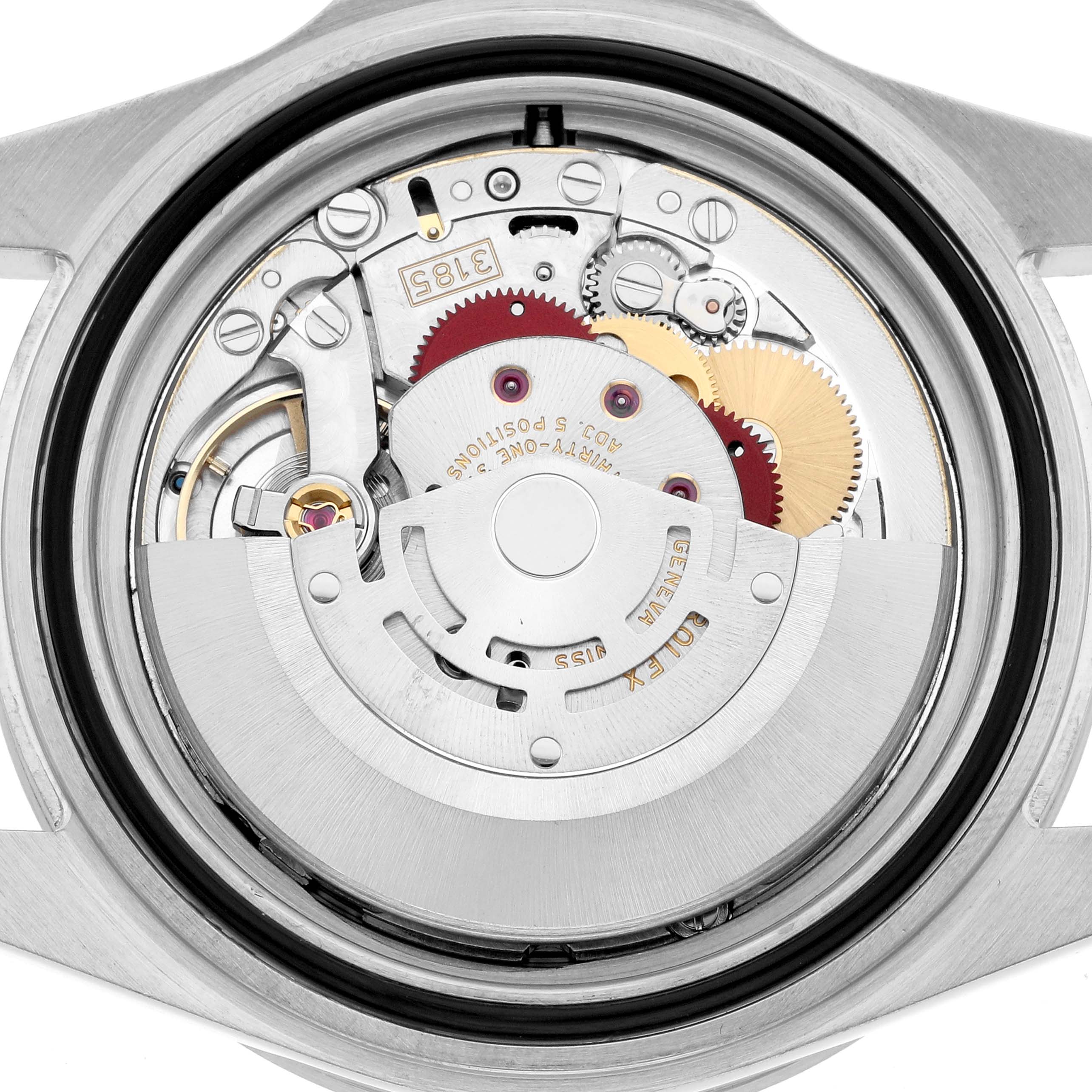 The image shows the Rolex Explorer 16570 Men
s Stainless Steel White Dial
s movement from a back angle, highlighting gears and the rotor.