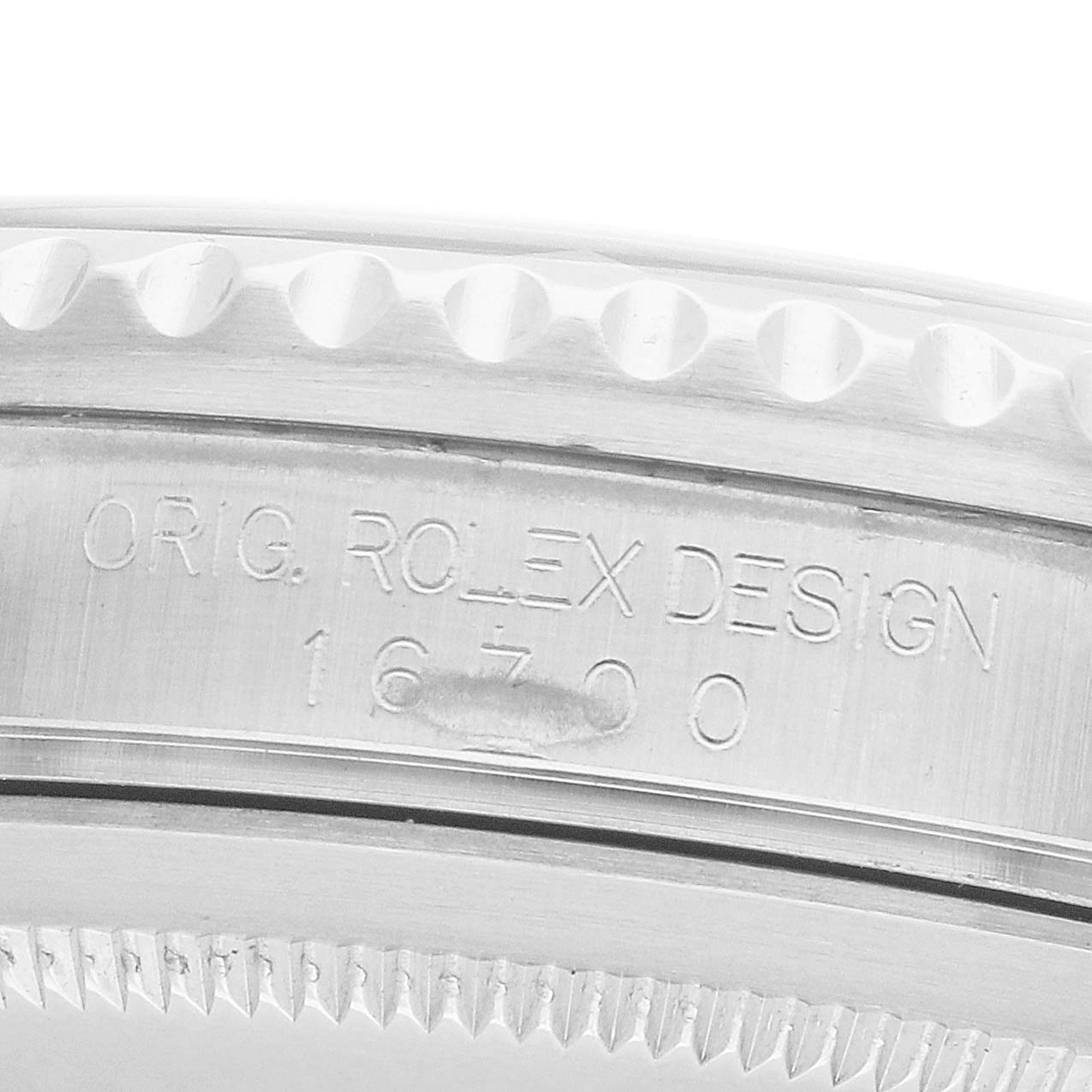 The image shows the side view of a Rolex GMT-Master 16700 Men
s Stainless Steel Black Dial watch, highlighting the engraved model number and edge of the bezel.