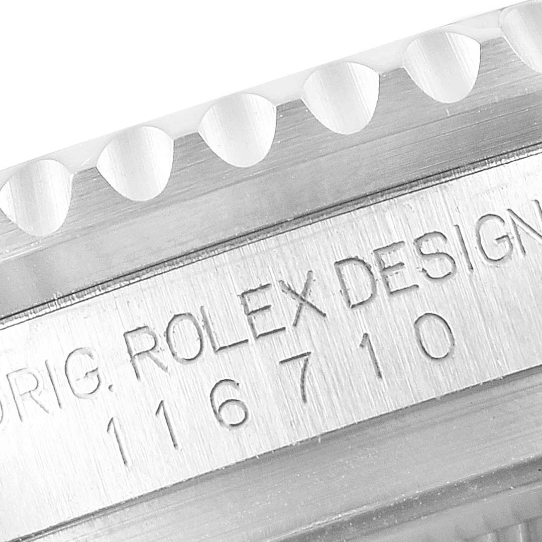 The image shows a close-up of the bezel and engraving of the Rolex GMT-Master 116710 Men
s Stainless Steel Black Dial 116710 Men
s Stainless Steel Black Dial model 116710.