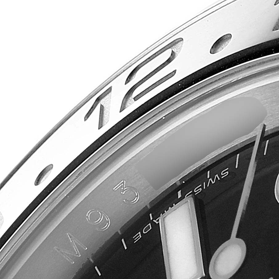 This close-up image shows the bezel and part of the dial of a Rolex GMT-Master 116710 Men
s Stainless Steel Black Dial 116710 Men
s Stainless Steel Black Dial watch, focusing on the hour marker and minute hand.