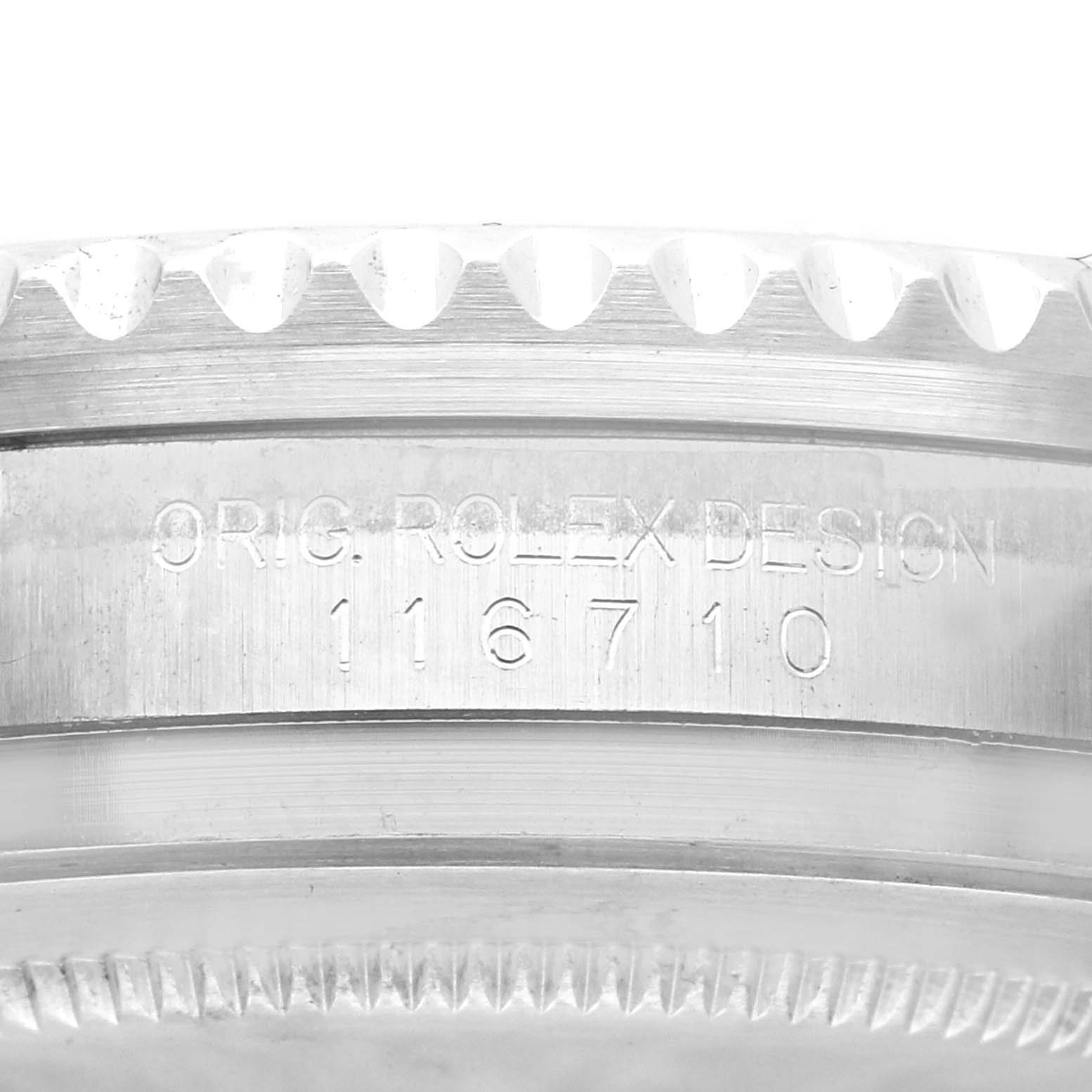 This image shows a close-up of the side of a Rolex GMT-Master 116710 Men
s Stainless Steel Black Dial 116710 Men
s Stainless Steel Black Dial, specifically highlighting the engraved serial number and design origins.