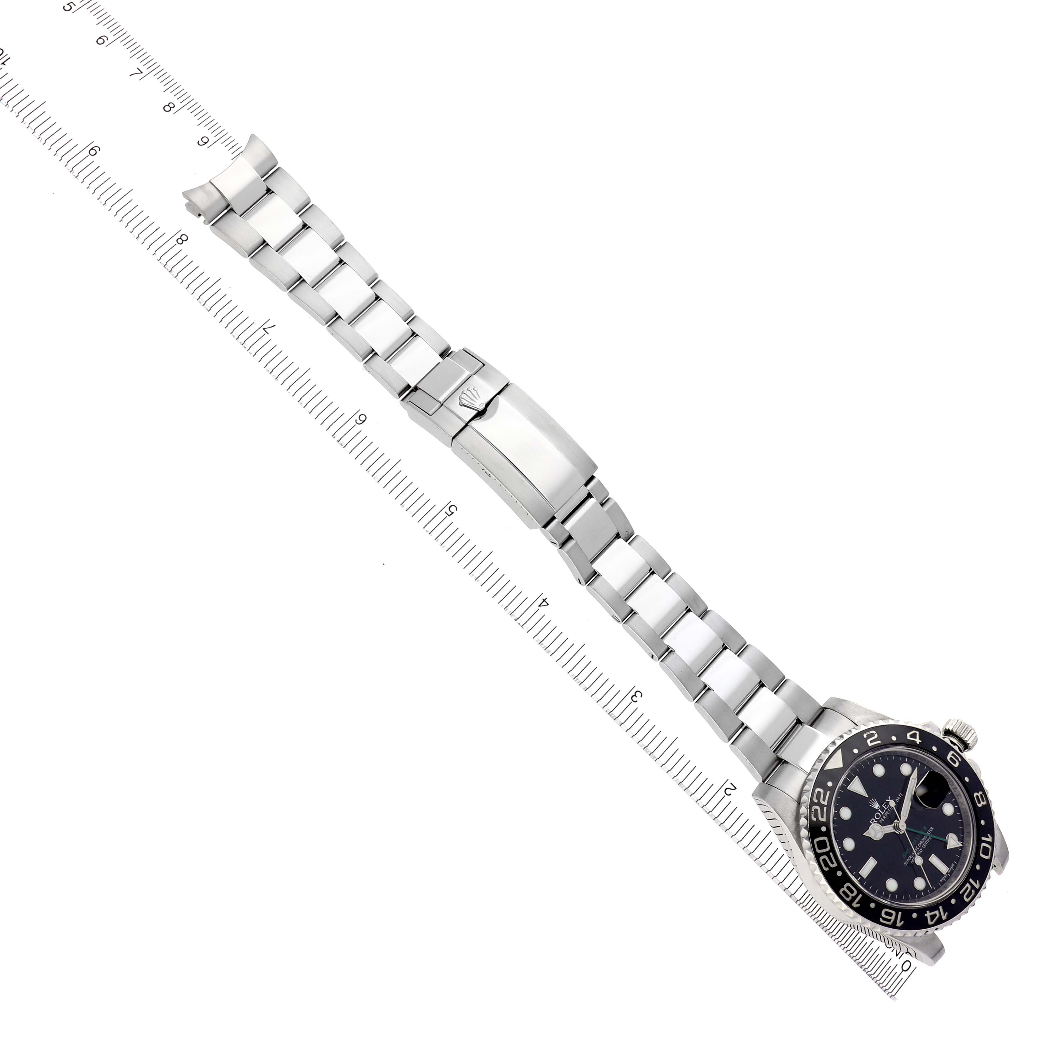 The image shows a top-down view of a Rolex GMT-Master 116710 Men
s Stainless Steel Black Dial 116710 Men
s Stainless Steel Black Dial watch, highlighting the watch face, bezel, bracelet, and clasp.