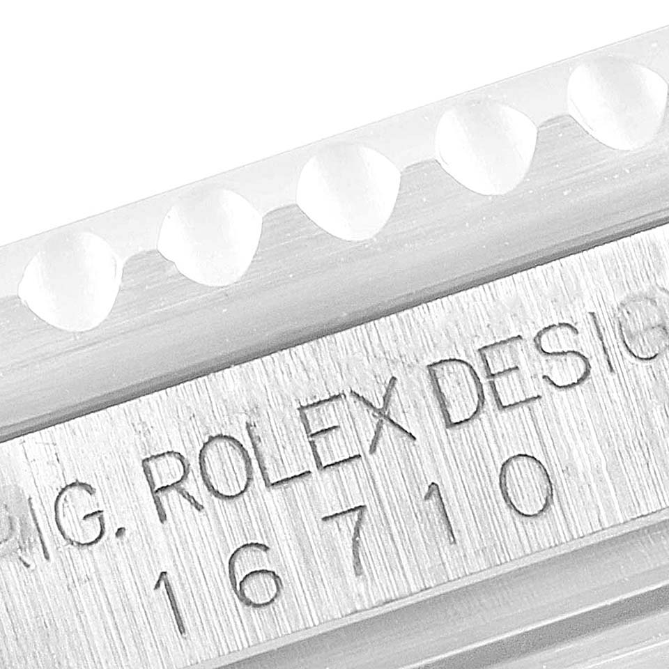 This close-up image shows the case engraving of a Rolex GMT-Master 16710 Men
s Stainless Steel Black Dial 16710 Men
s Stainless Steel Black Dial model with the reference number 16710.