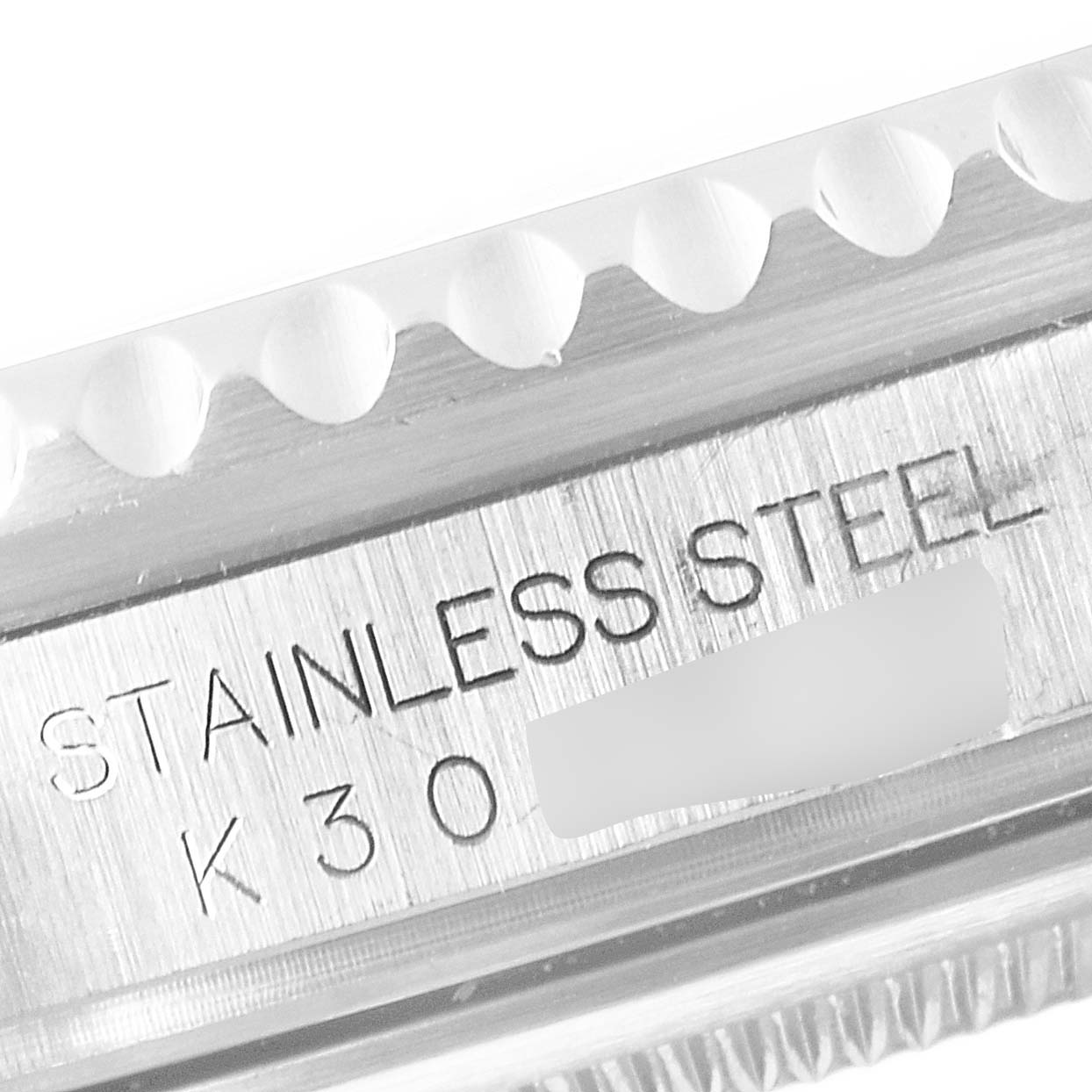 Close-up of the side of a Rolex GMT-Master 16710 Men
s Stainless Steel Black Dial 16710 Men
s Stainless Steel Black Dial watch, showing the "STAINLESS STEEL" engraving.