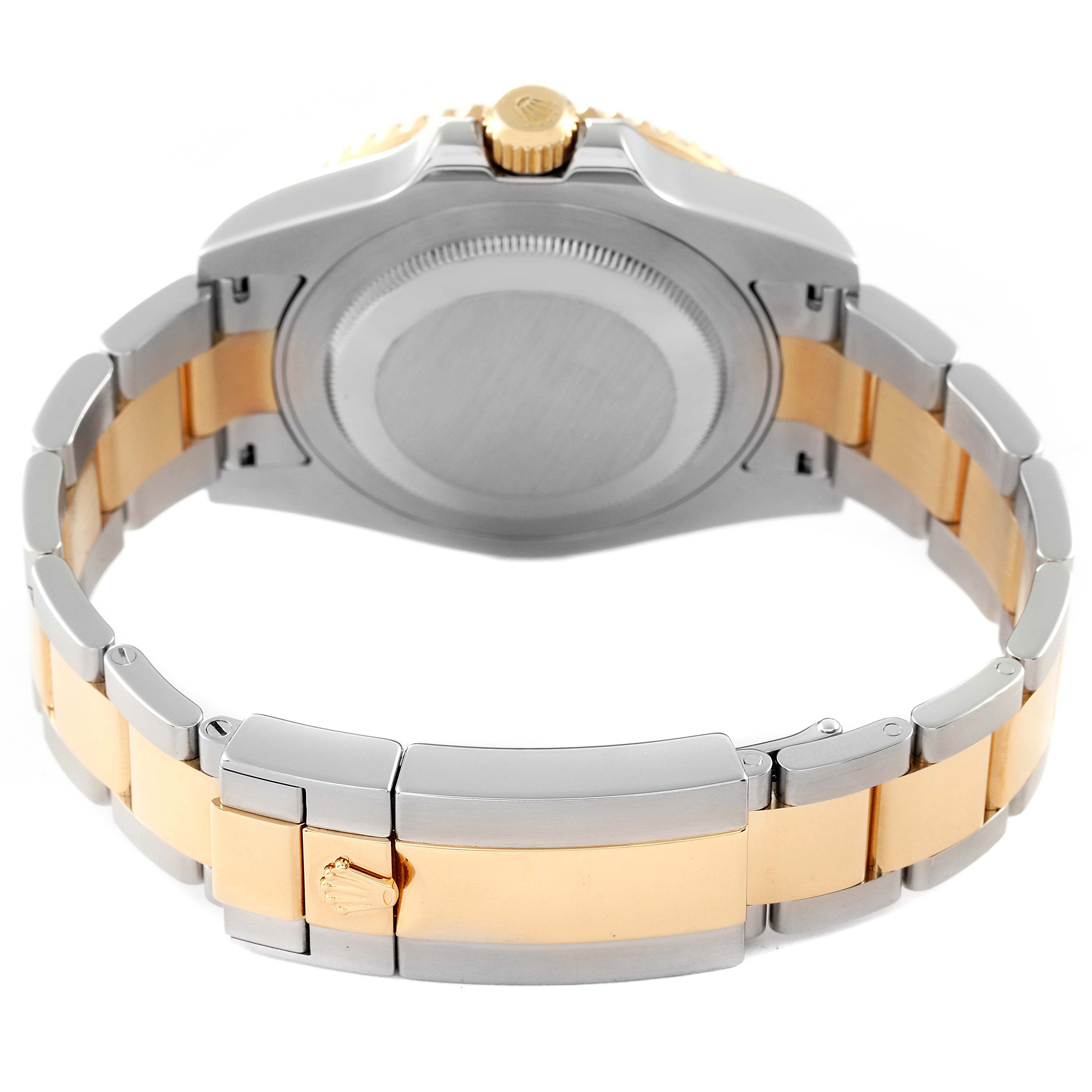 The image shows the back case and clasp of a Rolex GMT-Master 116713 Men's Steel and Gold (two tone) Black Dial 116713 Men's Steel and Gold (two tone) Black Dial watch, highlighting its two-tone bracelet.