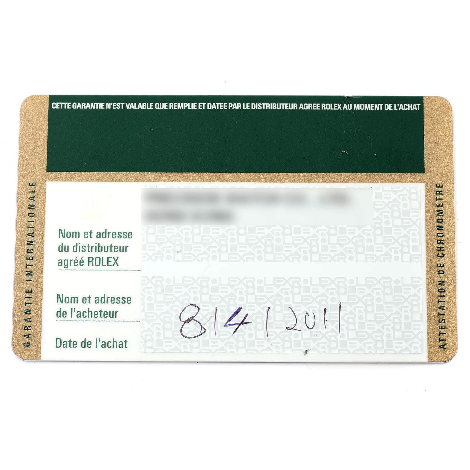 This image shows a Rolex GMT-Master 116713 Men's Steel and Gold (two tone) Black Dial 116713 Men's Steel and Gold (two tone) Black Dial model's warranty card with identifiable information blurred out.