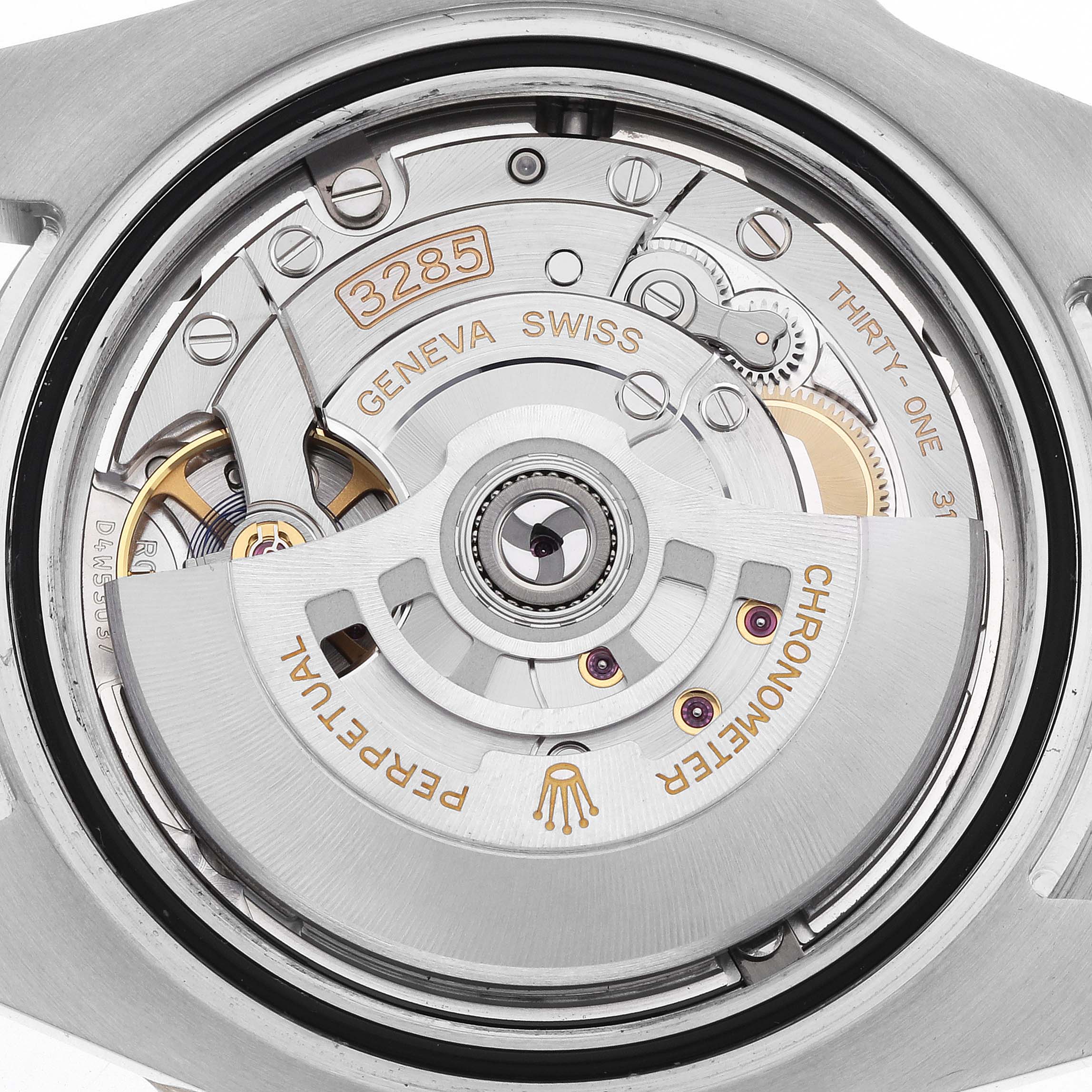 The image shows the movement mechanism of the Rolex GMT-Master 126713 Men
s Steel and Gold (two tone) Black Dial, viewed from the back, highlighting its intricate components.