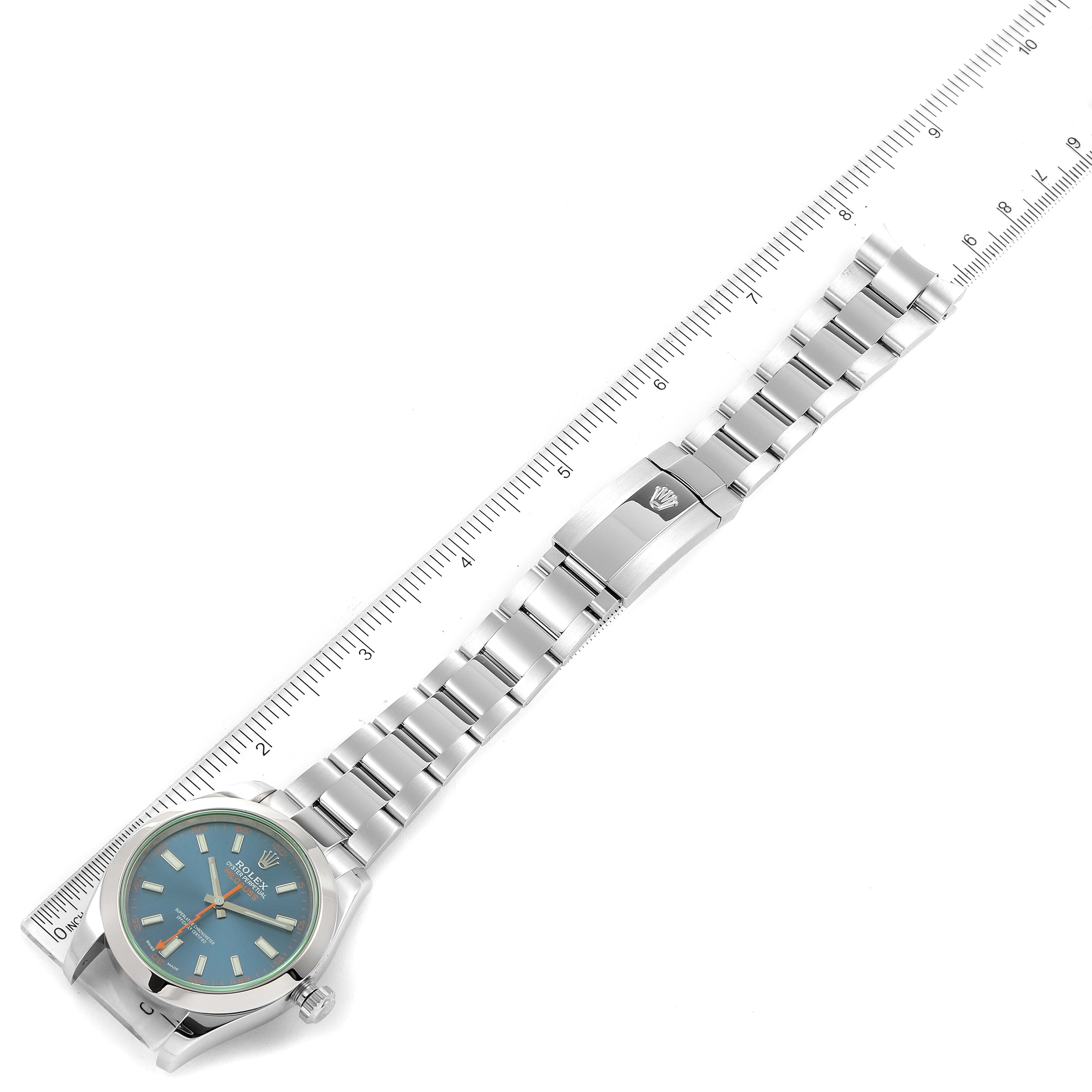 The image shows a Rolex Milgauss 116400GV Men's Stainless Steel Blue Dial 116400GV Men's Stainless Steel Blue Dial watch laid flat with a ruler, displaying the dial, bracelet, and clasp.