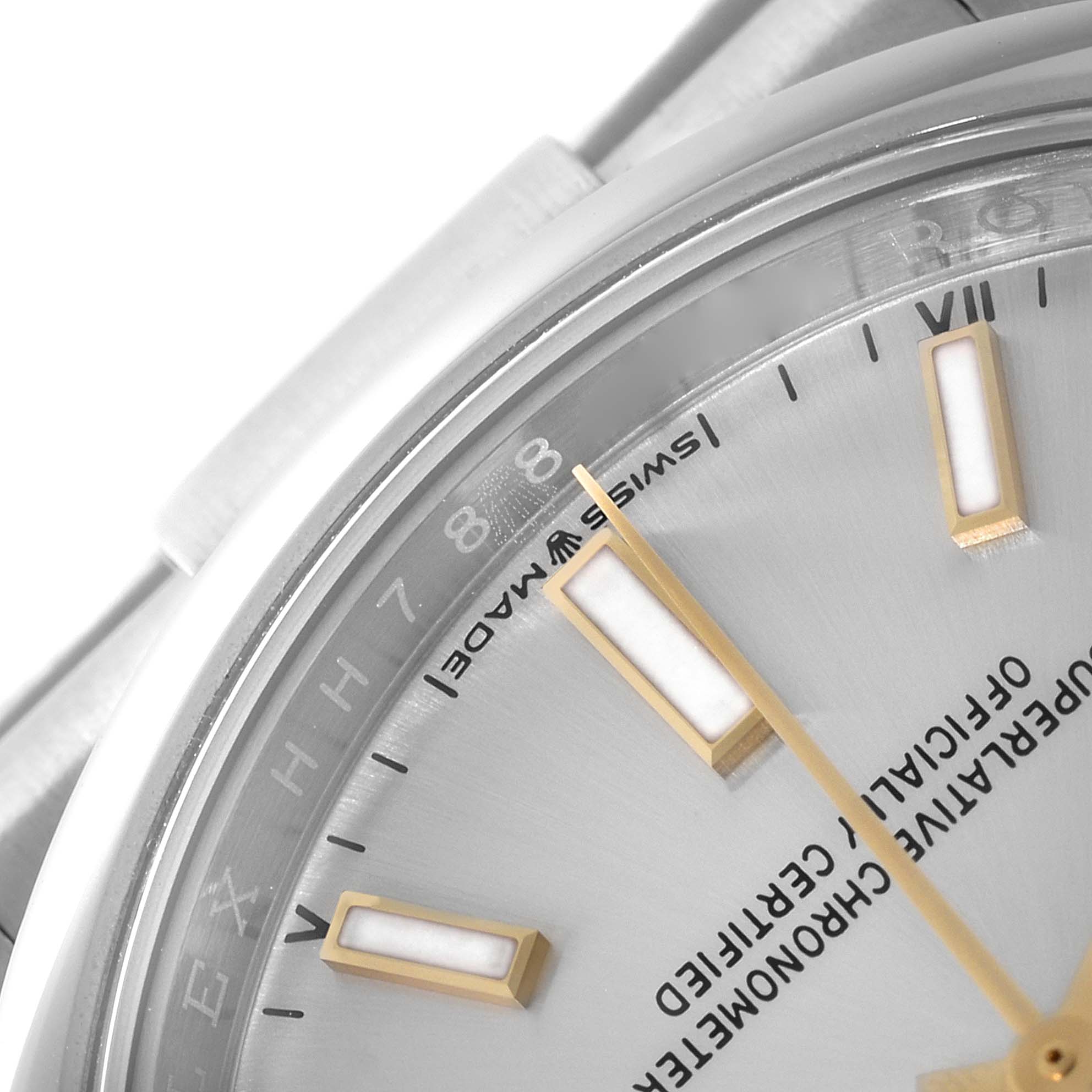 This close-up angle of a Rolex Oyster Perpetual 124200 Men's Stainless Steel Silver Dial 124200 Men's Stainless Steel Silver Dial watch shows the dial, part of the bezel, and some hour markers.