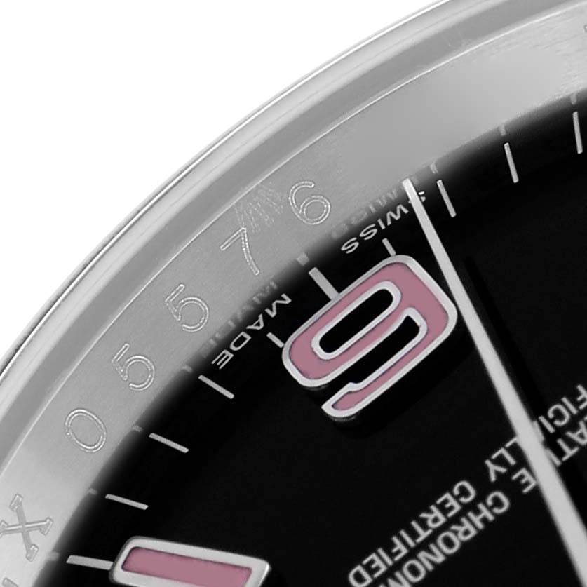 The image shows a close-up of the Rolex Oyster Perpetual 116000 Men
s Stainless Steel Black Dial dial with hour markers and partial numerals.