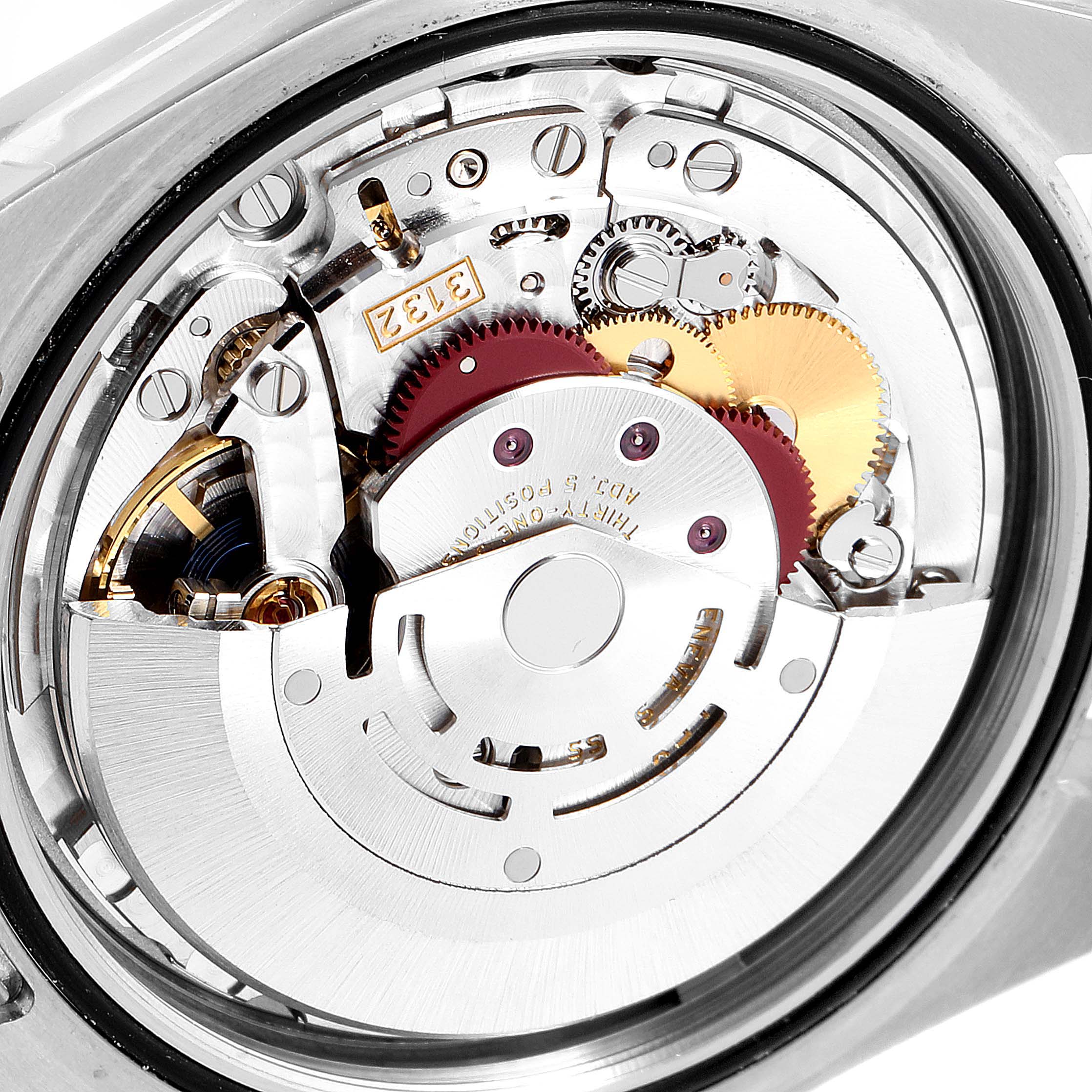 This image shows the internal mechanics of the Rolex Oyster Perpetual 114300 Men's Stainless Steel Burgundy Dial 114300 Men's Stainless Steel Burgundy Dial watch, highlighting the gears and movement components.