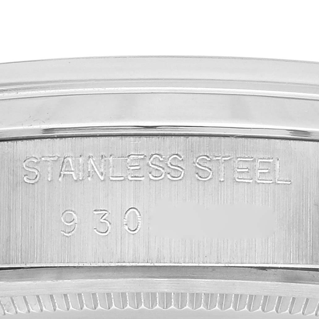 The image shows a close-up angle of the case back of a Vintage Collection Rolex watch, highlighting the engraved "Stainless Steel."
