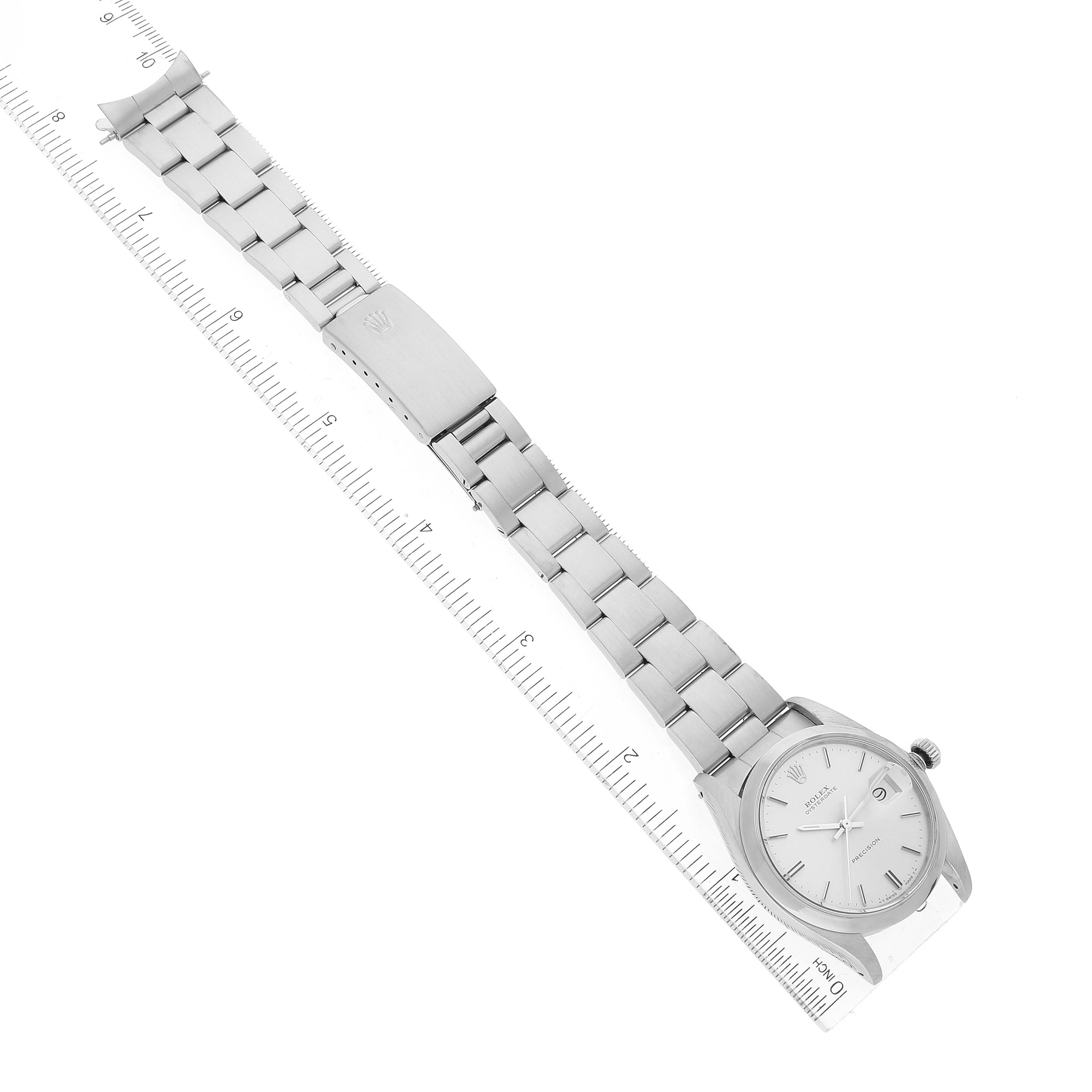 The Rolex Vintage Collection 6694 Men's Stainless Steel Silver Dial 6694 Men's Stainless Steel Silver Dial watch is displayed flat, showing the entire band and face alongside a ruler.