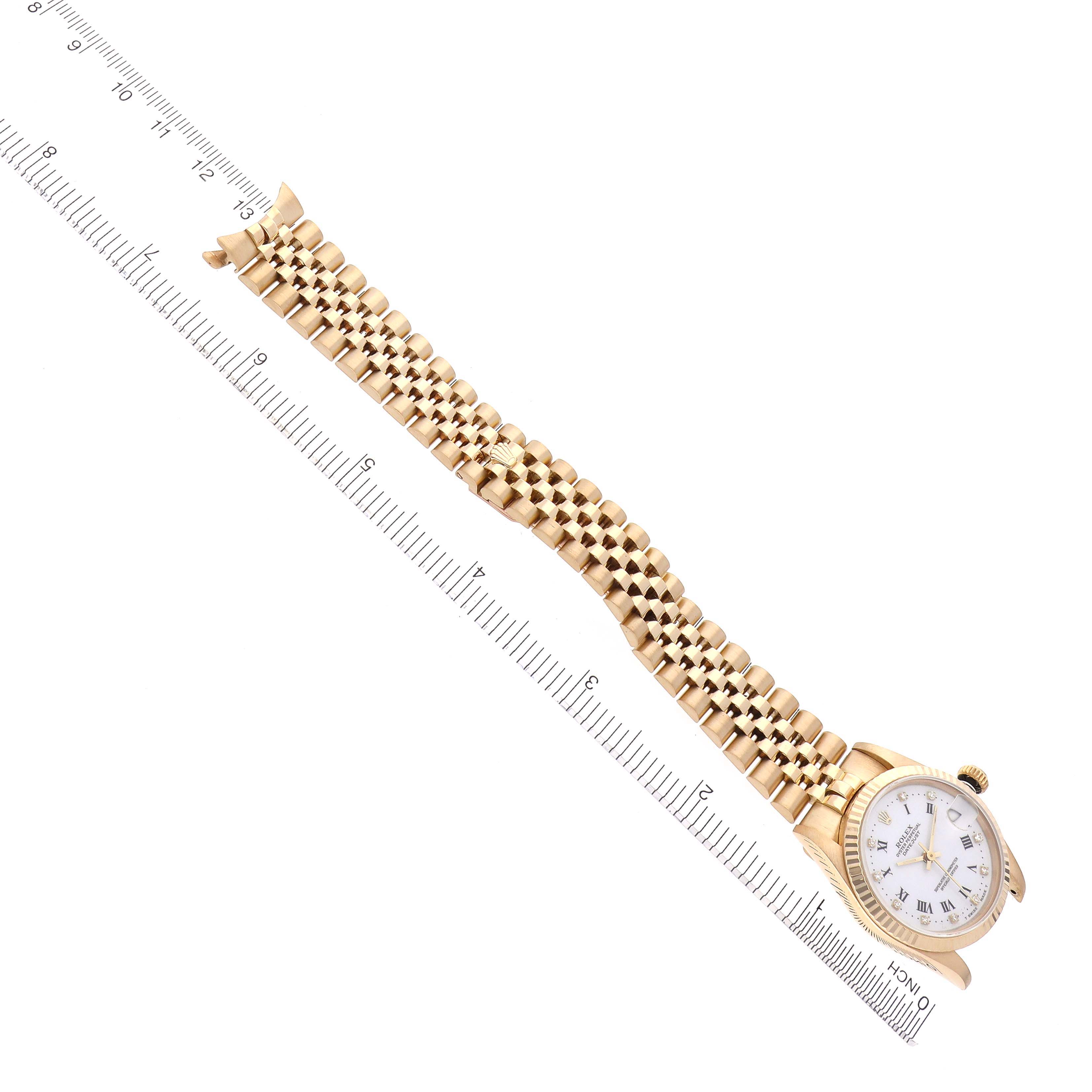 The Rolex Mid-Size 68278 Women's Yellow Gold White Dial 68278 Women's Yellow Gold White Dial model watch is shown flat with its face and entire bracelet visible alongside a ruler.