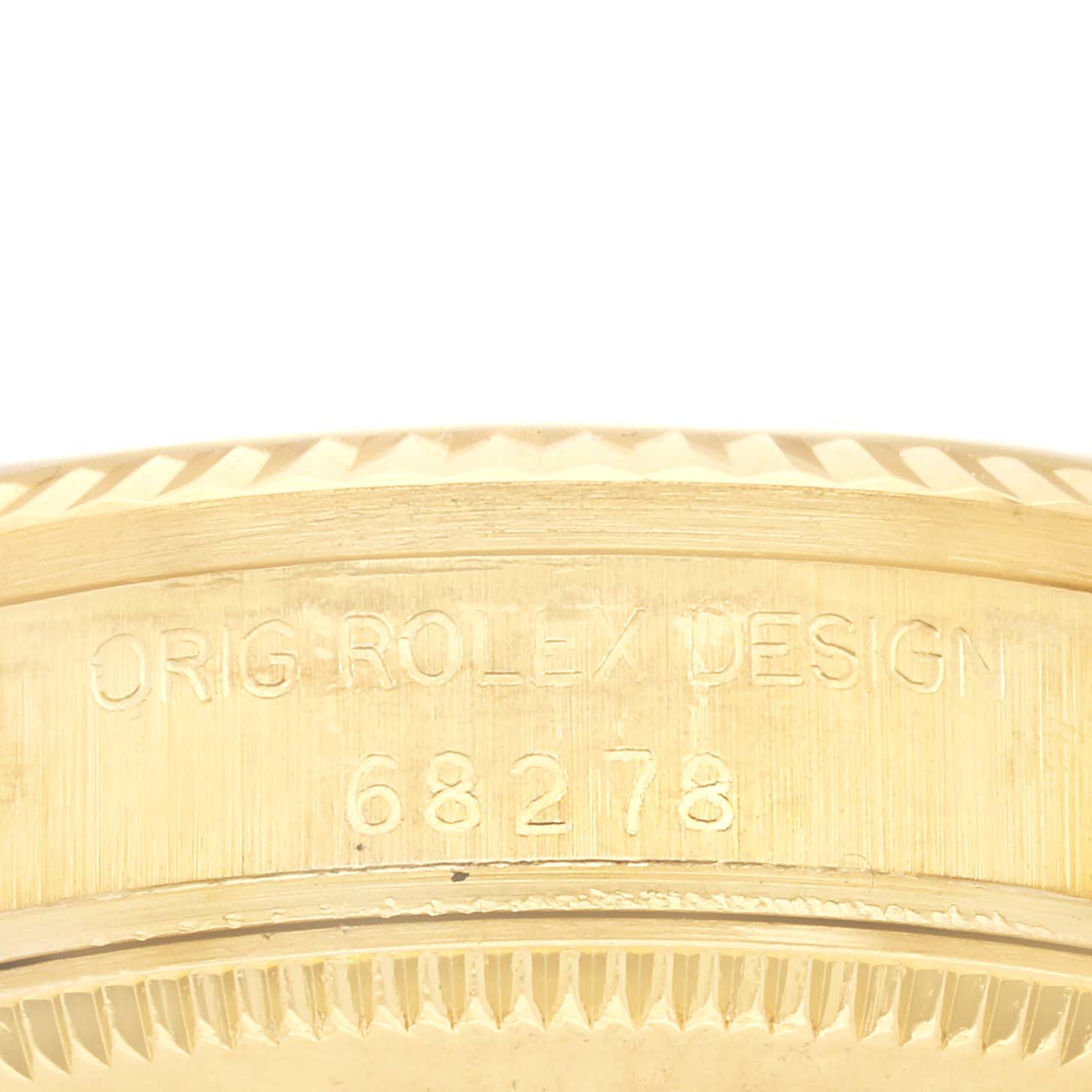 This image shows a close-up, side view of the Rolex Mid-Size 68278 Women's Yellow Gold White Dial 68278 Women's Yellow Gold White Dial model's casing with model number 68278 engraved on it.