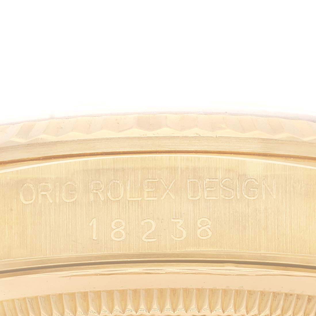 This image shows a close-up of the side of the bezel and case of a Rolex President 18238 Men's Yellow Gold Champagne Dial 18238 Men's Yellow Gold Champagne Dial model, displaying its design and model number.