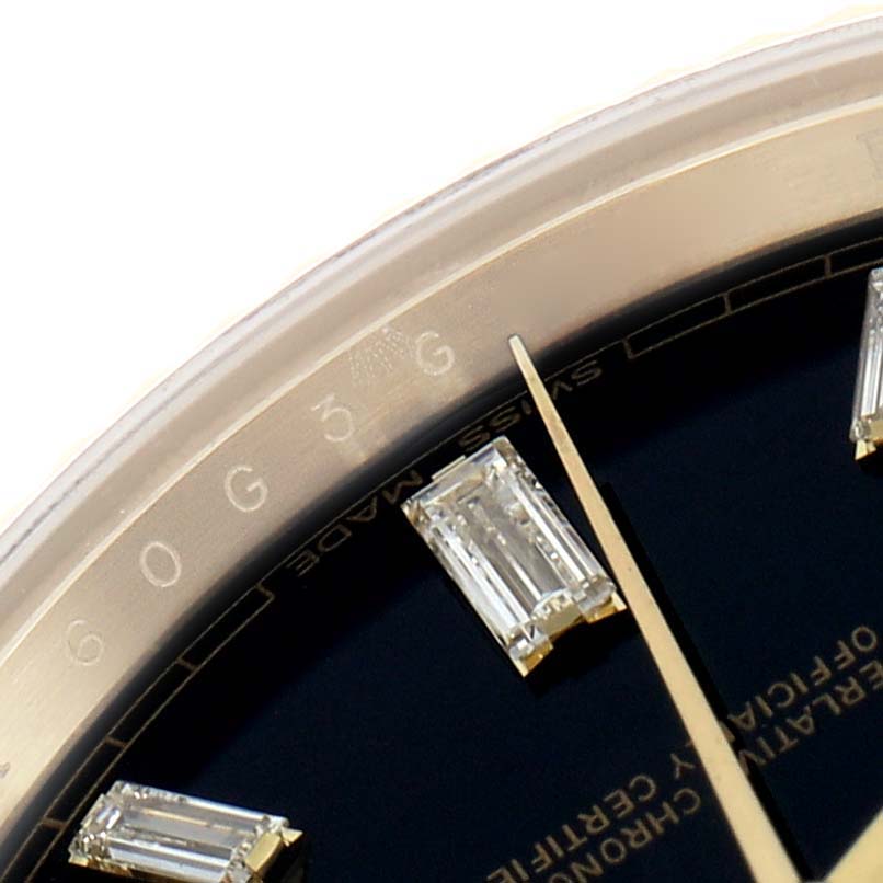 The image shows a close-up of the Rolex President 228238 Men
s Yellow Gold Black Dial watch, highlighting the bezel, part of the dial, and diamond markers.
