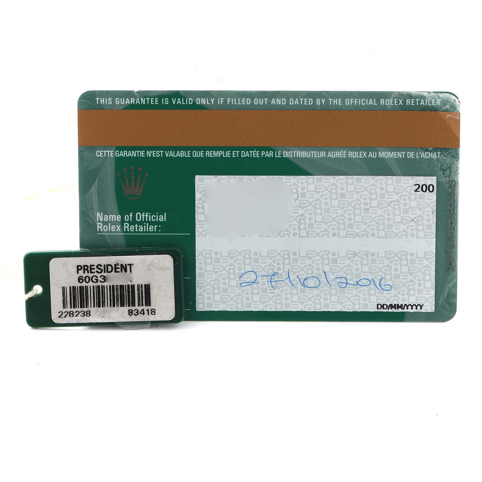 The image shows a warranty card and tag for a Rolex President 228238 Men
s Yellow Gold Black Dial model, displaying the outer design and date of purchase.