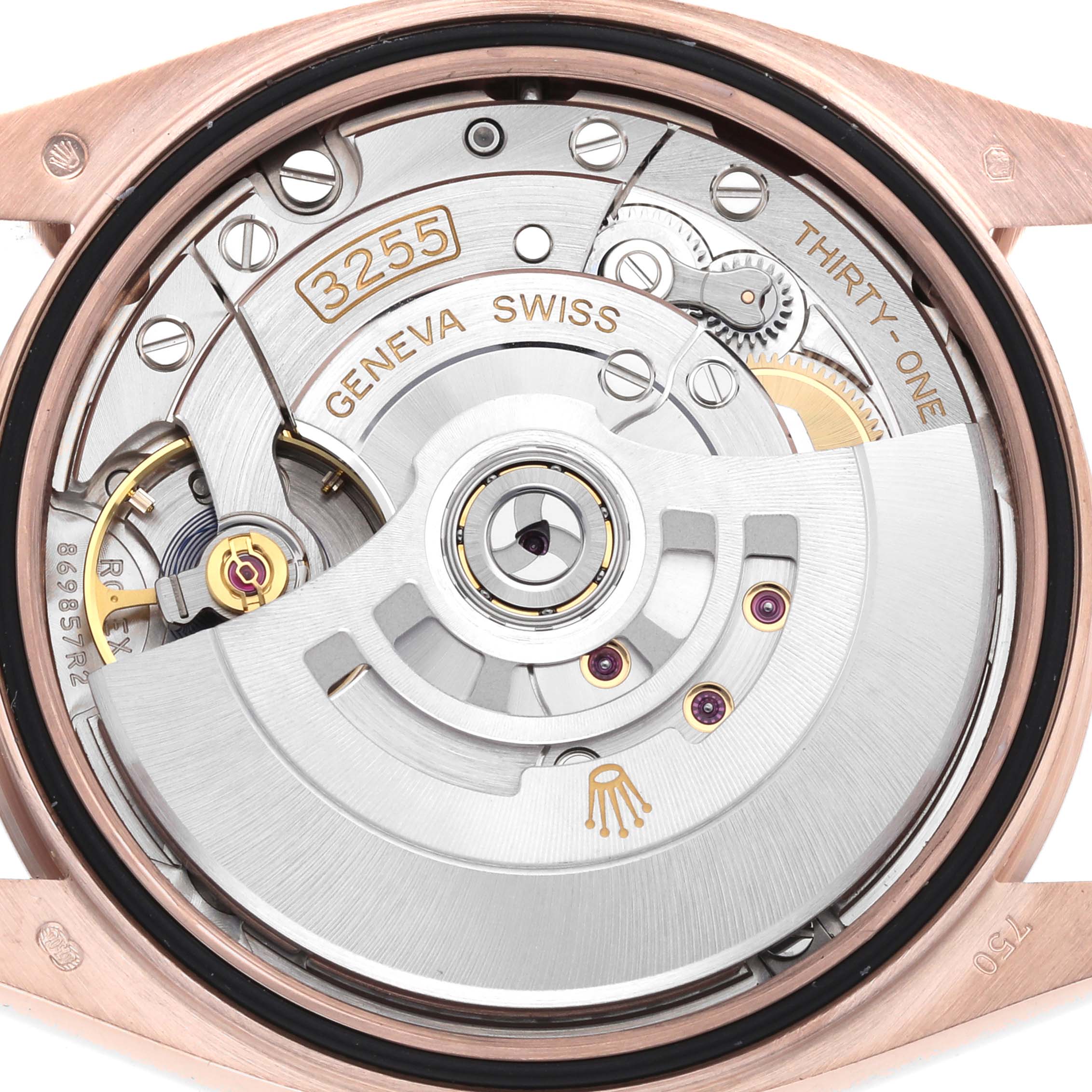 The image shows the movement of a Rolex President 128235 Men
s Rose Gold Mother of Pearl Dial model watch from a top-down angle, highlighting its intricate mechanical parts.