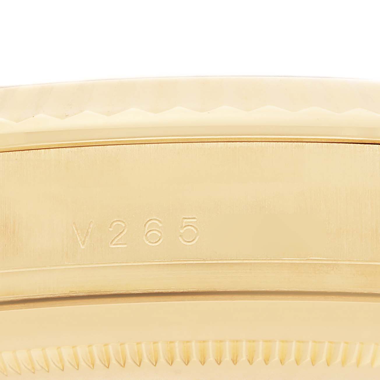 The image shows a close-up of the side of the Rolex President 218238 Men
s Yellow Gold Champagne Dial model, highlighting the engraved reference number.