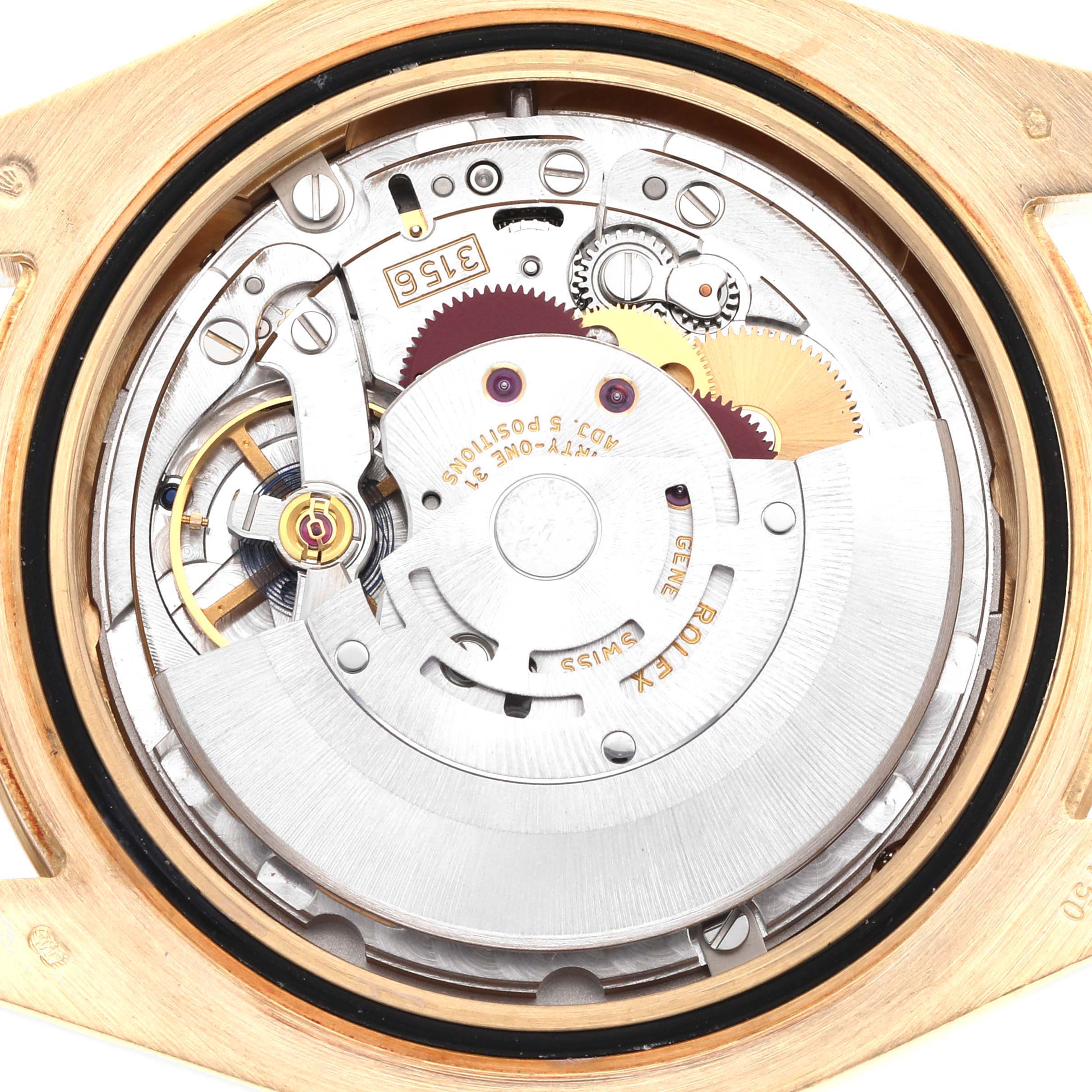 The image shows the movement of a Rolex President 218238 Men
s Yellow Gold Champagne Dial watch from a top-down angle, highlighting gears and the rotor.