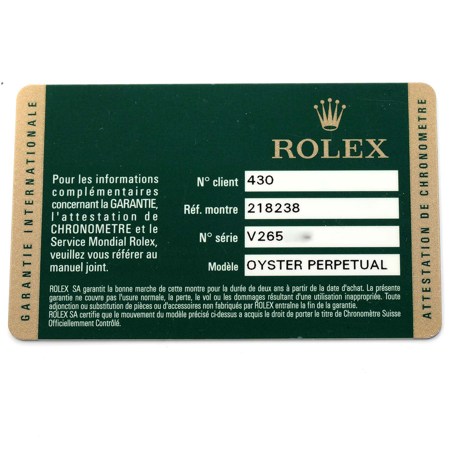 The image shows a warranty card for a Rolex Oyster Perpetual with reference and serial numbers.