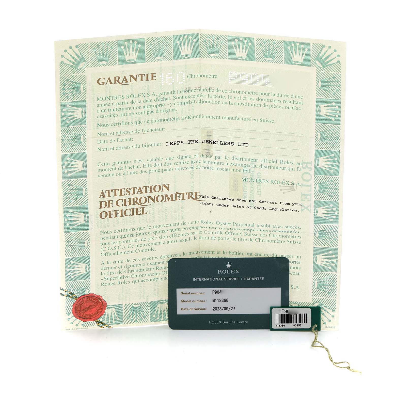 The image shows the warranty paperwork and service guarantee card for a Rolex President 118366 Men
s Platinum Silver Dial model, displayed at an angle.