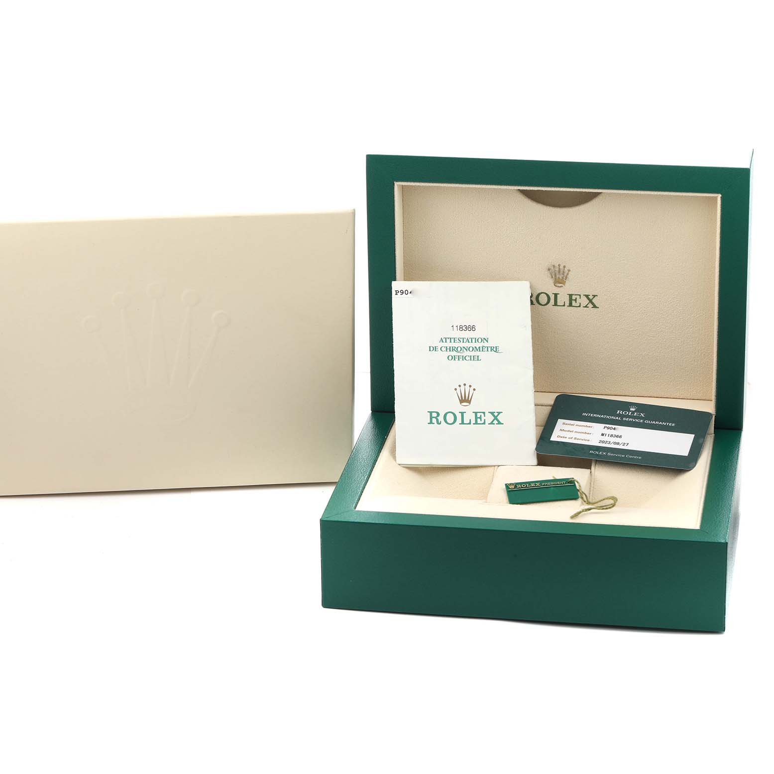 The image shows a Rolex President 118366 Men
s Platinum Silver Dial model watch box, open to display paperwork, a tag, and a card, with an outer box beside it.