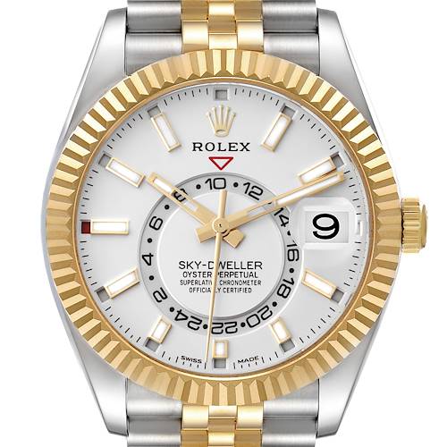 The Rolex Sky-Dweller watch is shown from a straight-on angle, highlighting its face, bezel, and part of the bracelet.