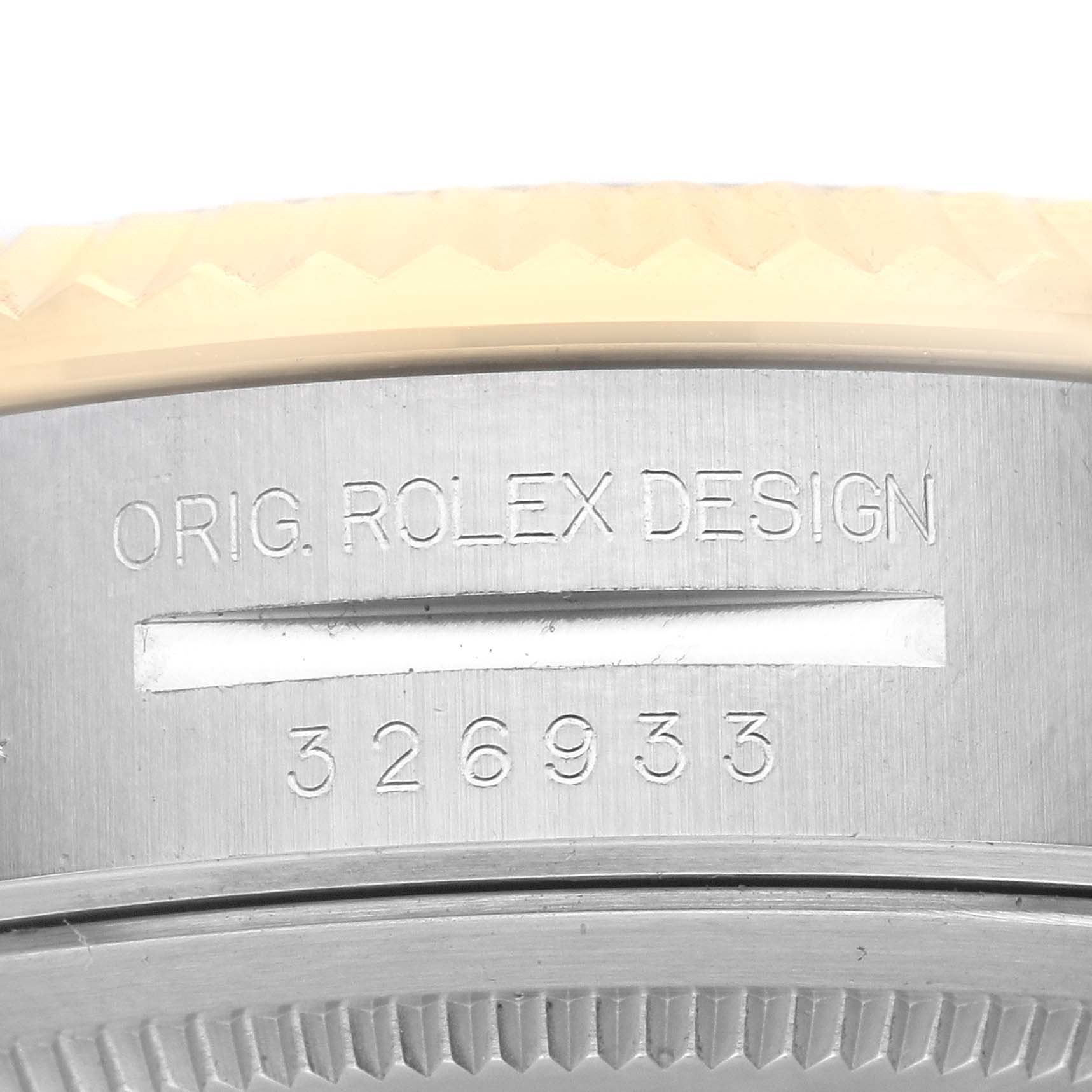 The image shows a close-up of the Rolex Sky-Dweller 326933 Men's Steel and Gold (two tone) White Dial 326933 Men's Steel and Gold (two tone) White Dial's case with engraved text and the model number 326933.
