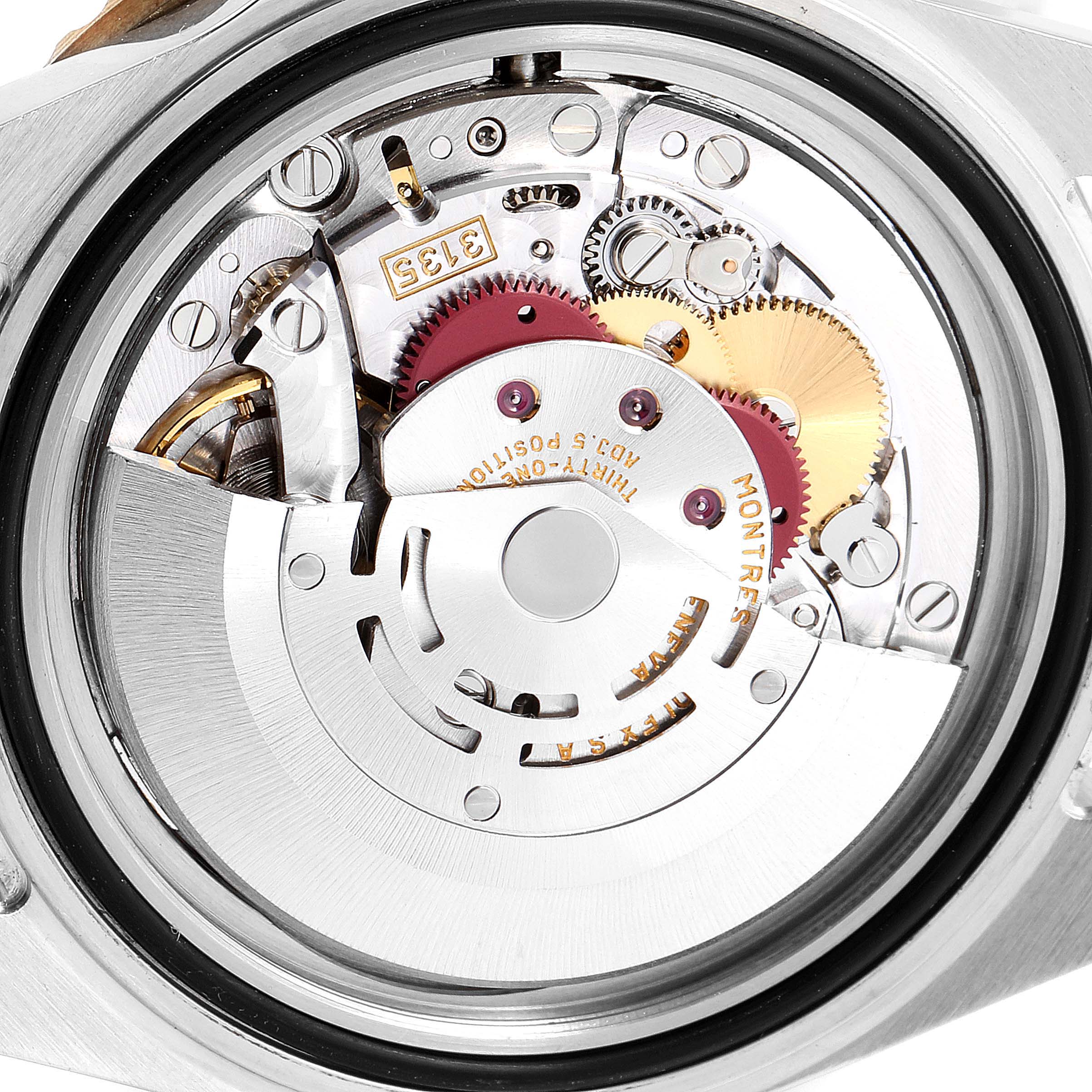 The image shows the internal movement mechanism of a Rolex Submariner 16613 Men's Steel and Gold (two tone) Blue Dial 16613 Men's Steel and Gold (two tone) Blue Dial watch, viewed from the back case.