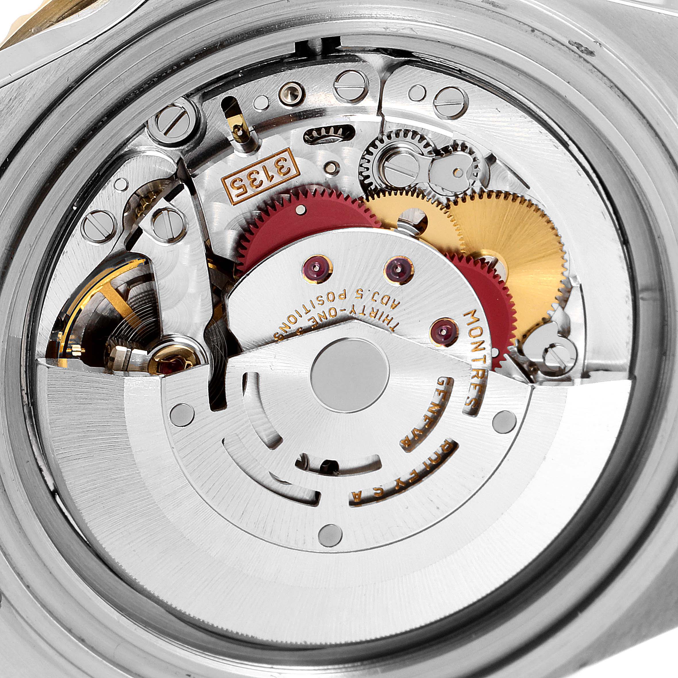 The image shows the internal mechanical movement of a Rolex Submariner 16613 Men's Steel and Gold (two tone) Blue Dial 16613 Men's Steel and Gold (two tone) Blue Dial watch from a rear angle.