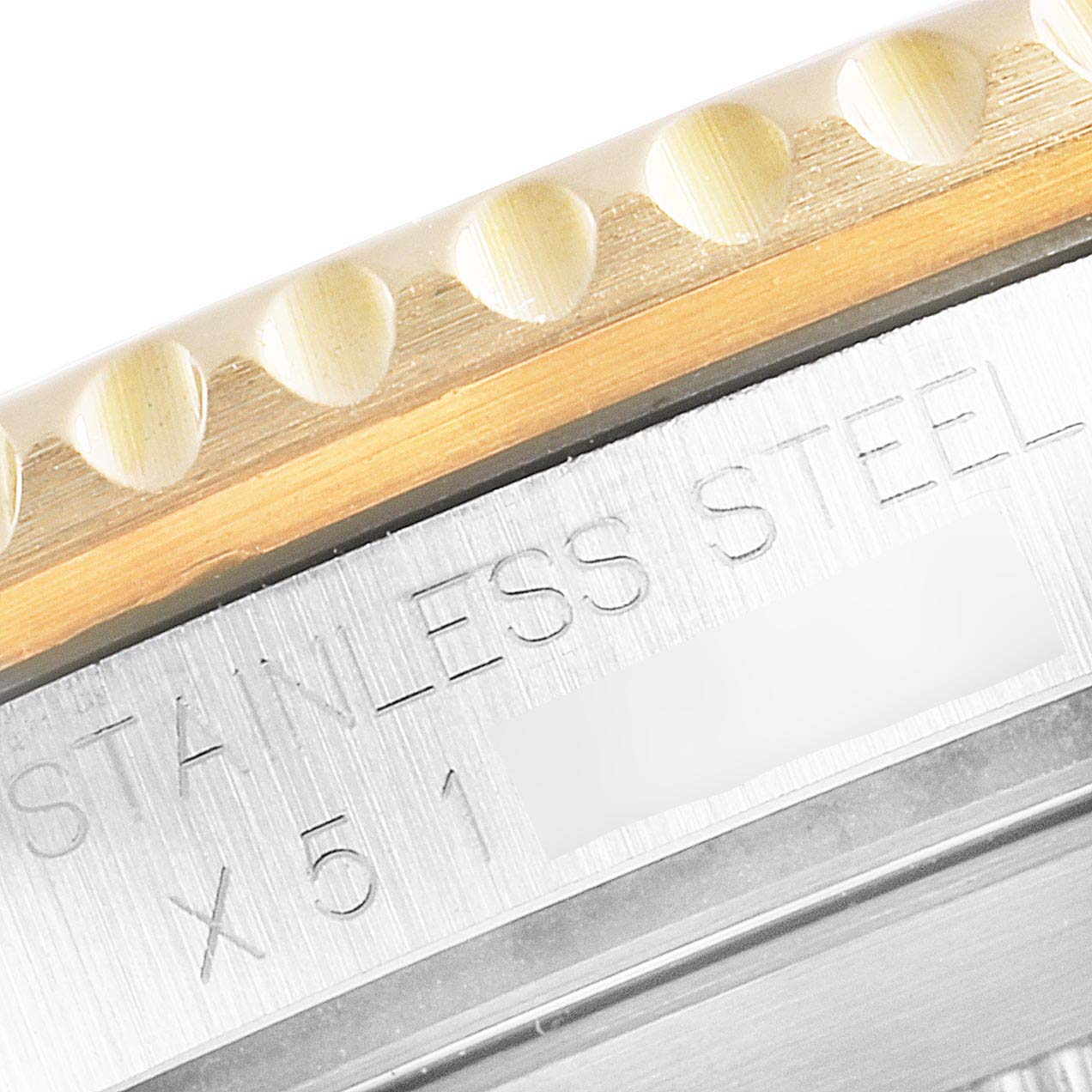 This close-up of a Rolex Submariner 16613 Men's Steel and Gold (two tone) Black Dial 16613 Men's Steel and Gold (two tone) Black Dial shows the side of the stainless steel casing and part of the bezel.