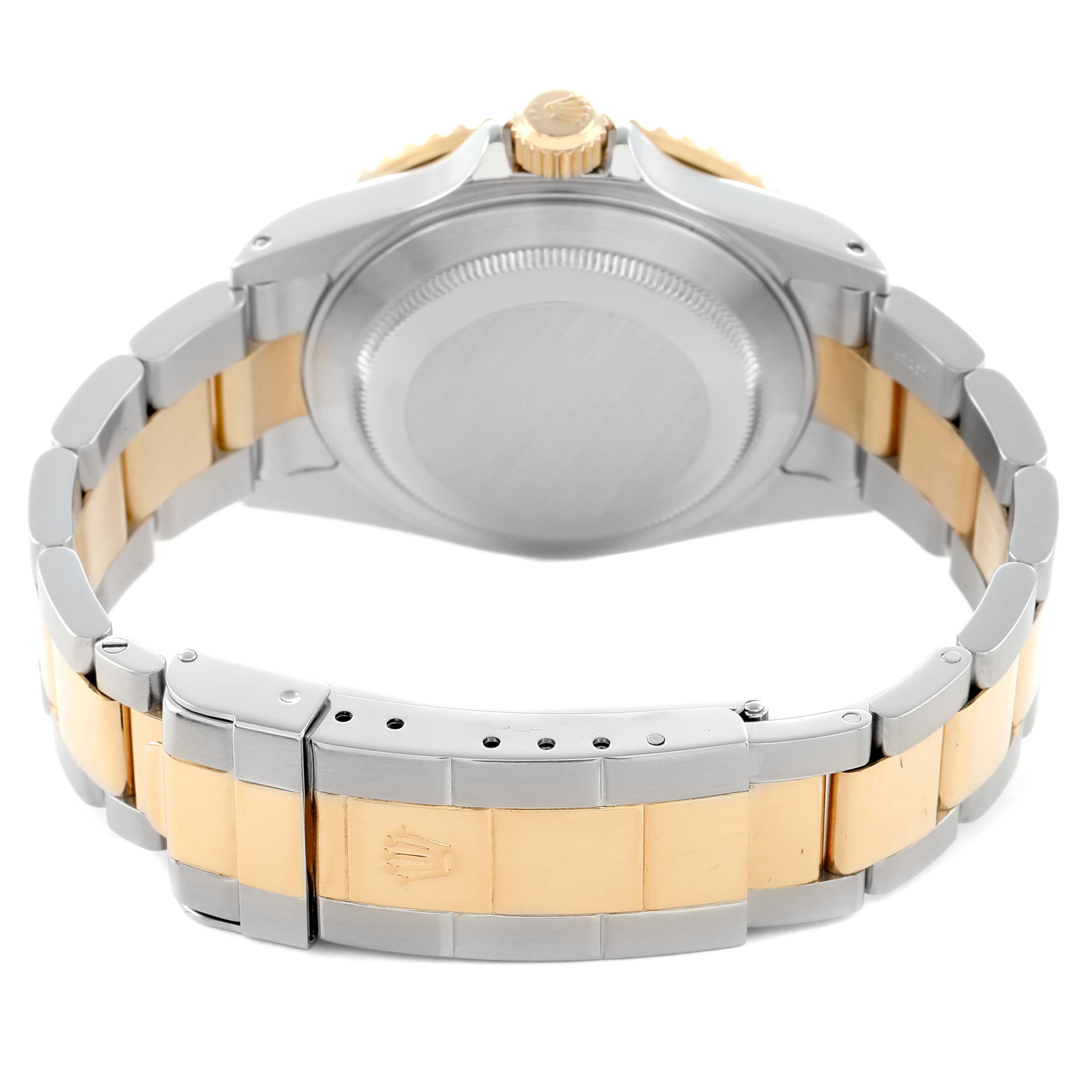 The image shows the back view of a Rolex Submariner 16613 Men
s Steel and Gold (two tone) Blue Dial, highlighting the case back, crown, and two-tone bracelet with clasp.