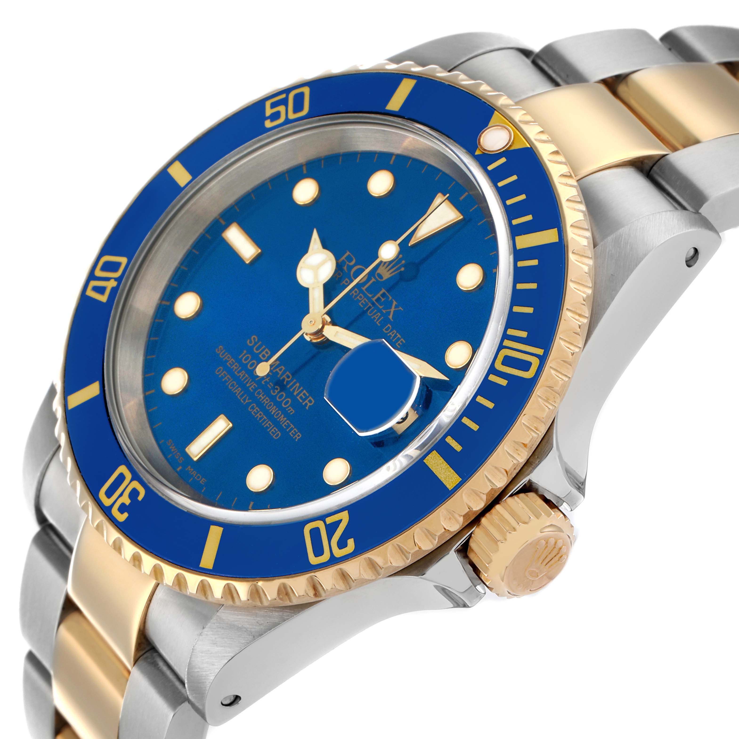 The Rolex Submariner 16613 Men
s Steel and Gold (two tone) Blue Dial watch is shown from an angled side view, highlighting the blue face and bezel, gold accents, and two-tone bracelet.