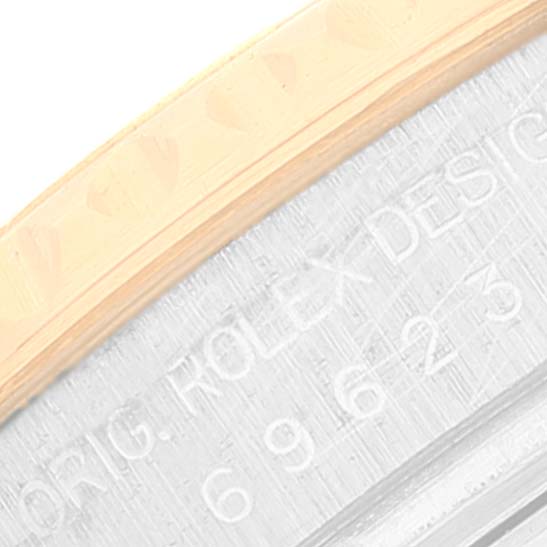 The image shows a close-up of the side of the Rolex Yacht-Master 69623 Women's Steel and Gold (two tone) White Dial 69623 Women's Steel and Gold (two tone) White Dial watch's case and engraving.