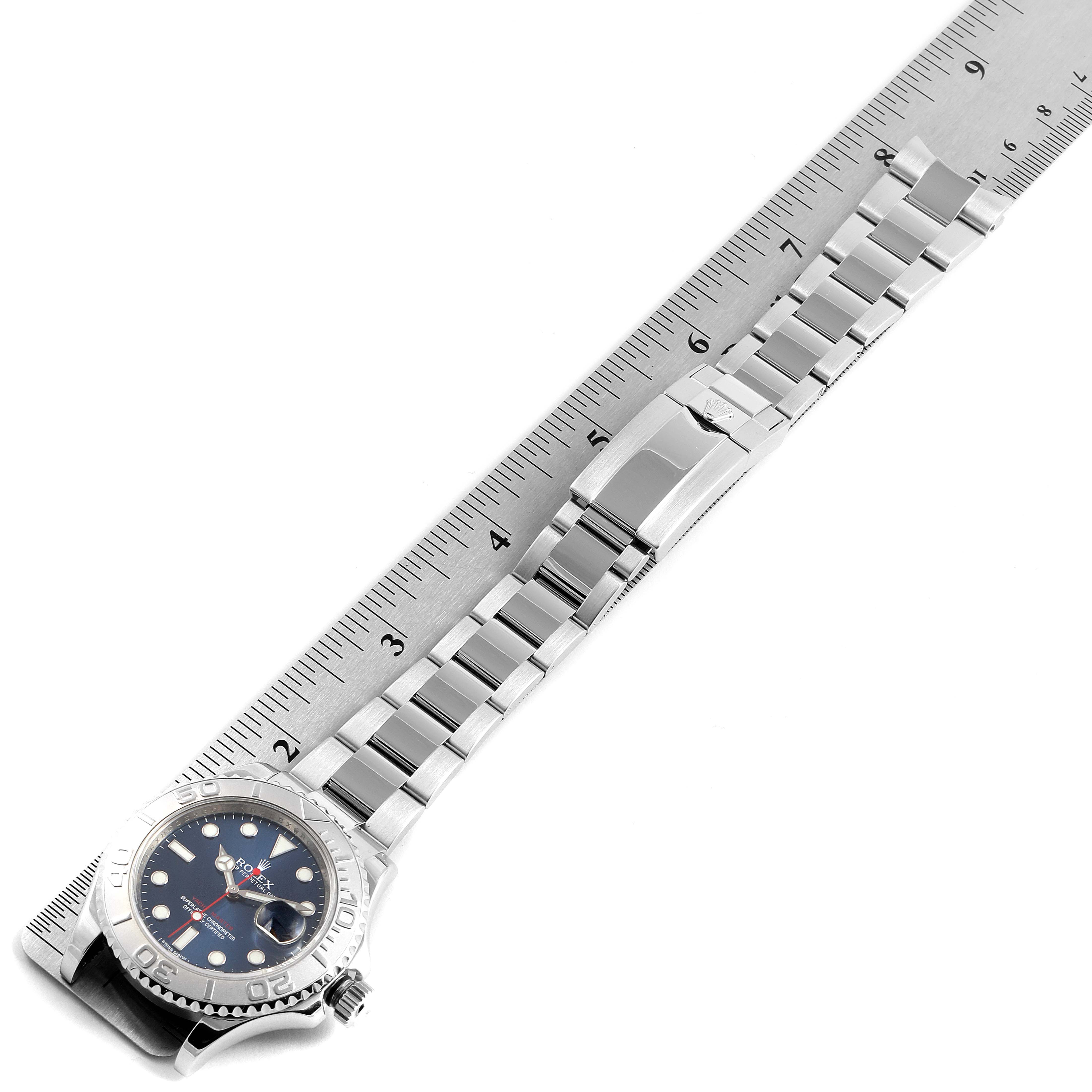 The image shows a top-down view of a Rolex Yacht-Master 116622 Men's Stainless Steel Blue Dial 116622 Men's Stainless Steel Blue Dial watch, highlighting its face, bezel, bracelet, and clasp.