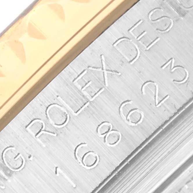 The image shows a close-up of the Rolex engraving and part of the bezel of a Yacht-Master model watch by Rolex.