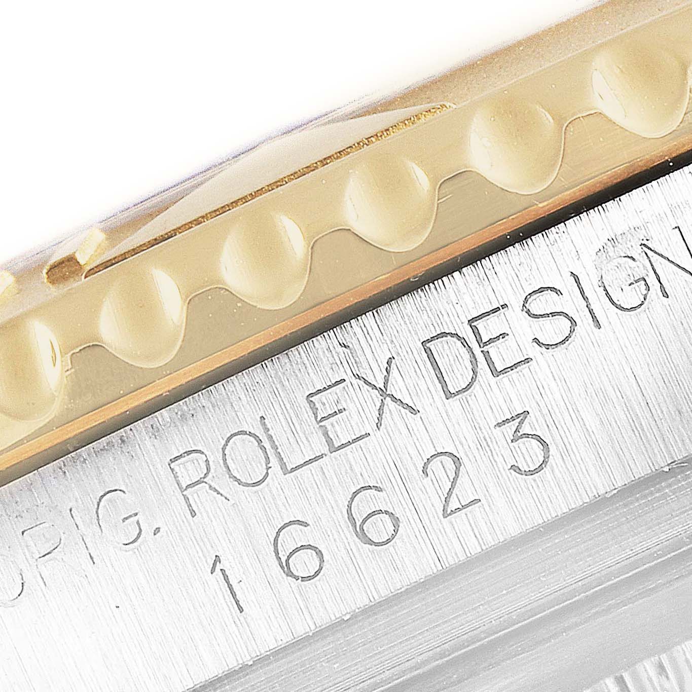 This close-up shows the bezel and case side of a Rolex Yacht-Master 16623 Men's Steel and Gold (two tone) White Dial 16623 Men's Steel and Gold (two tone) White Dial watch, including the model number "16623".