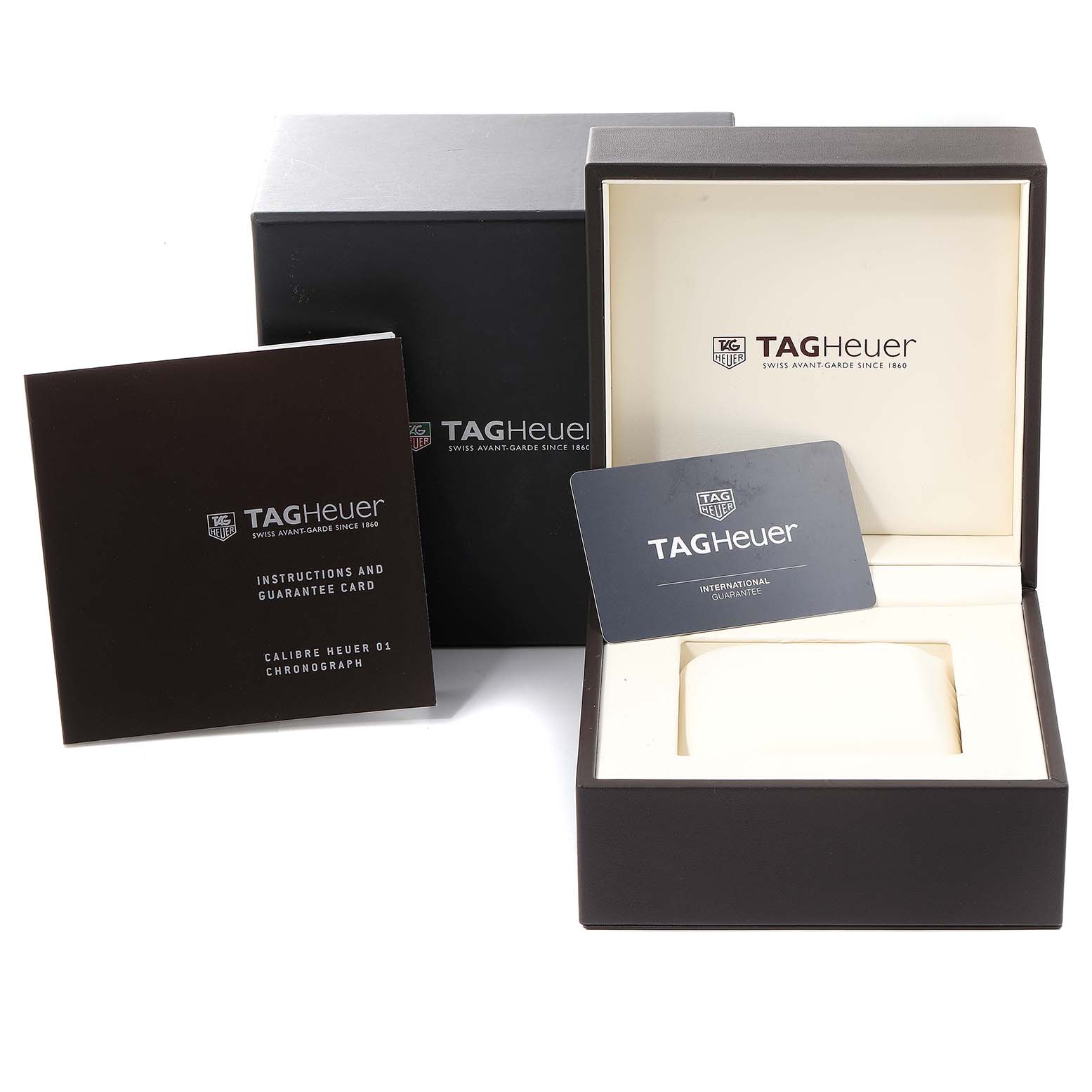 The image shows a Tag Heuer Carrera CAR201T.BA0766 Men's Stainless Steel Blue Dial CAR201T.BA0766 Men's Stainless Steel Blue Dial watch's open box, instruction manual, and guarantee card.