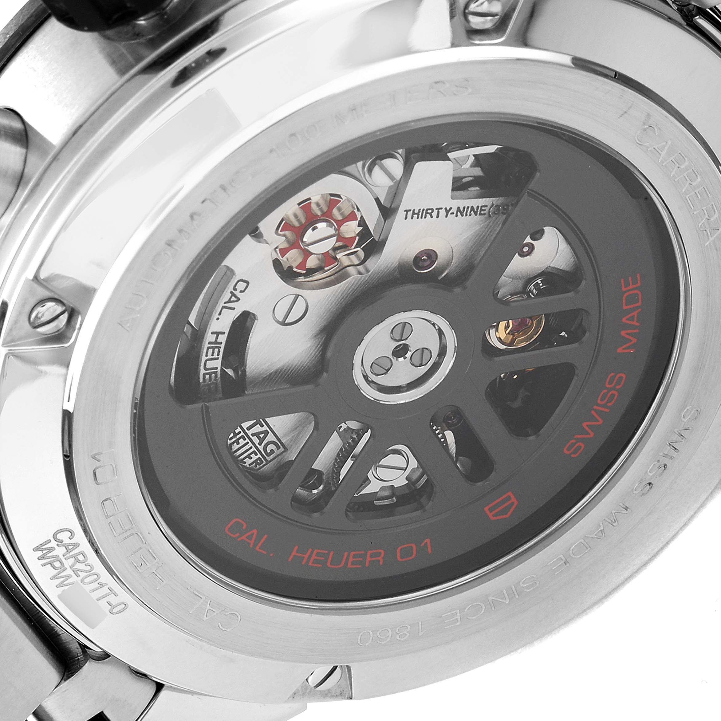 The image shows the back view of a Tag Heuer Carrera CAR201T.BA0766 Men's Stainless Steel Blue Dial CAR201T.BA0766 Men's Stainless Steel Blue Dial watch, revealing its intricate movement and "Cal Heuer 01" engravings.