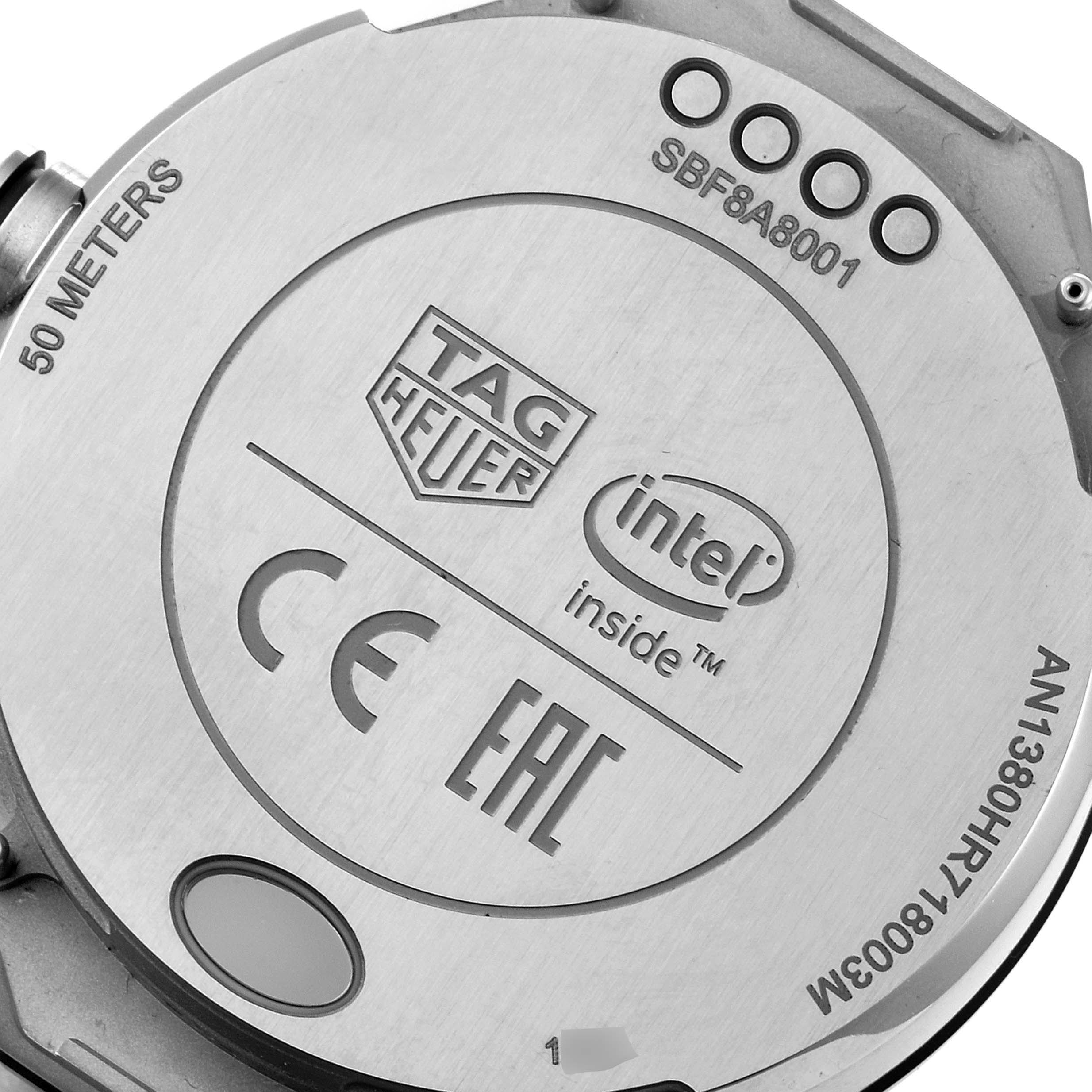 This image shows the back case of a Tag Heuer Carrera ACBF5A80 Men's Titanium Black Dial ACBF5A80 Men's Titanium Black Dial watch, featuring brand engravings and technical information.