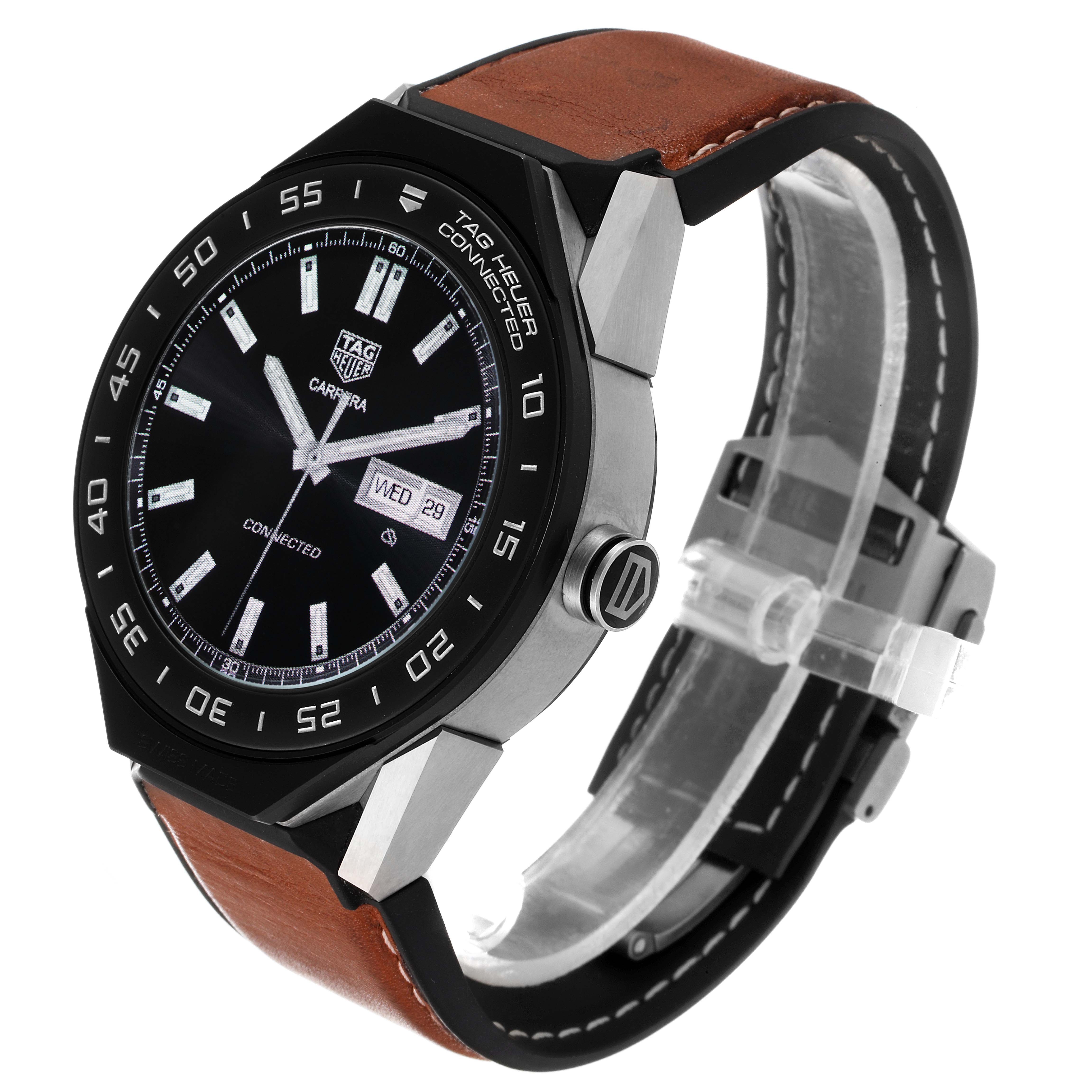 The image shows a Tag Heuer Carrera ACBF5A80 Men's Titanium Black Dial ACBF5A80 Men's Titanium Black Dial watch at an angle highlighting the face, bezel, crown, and leather strap.