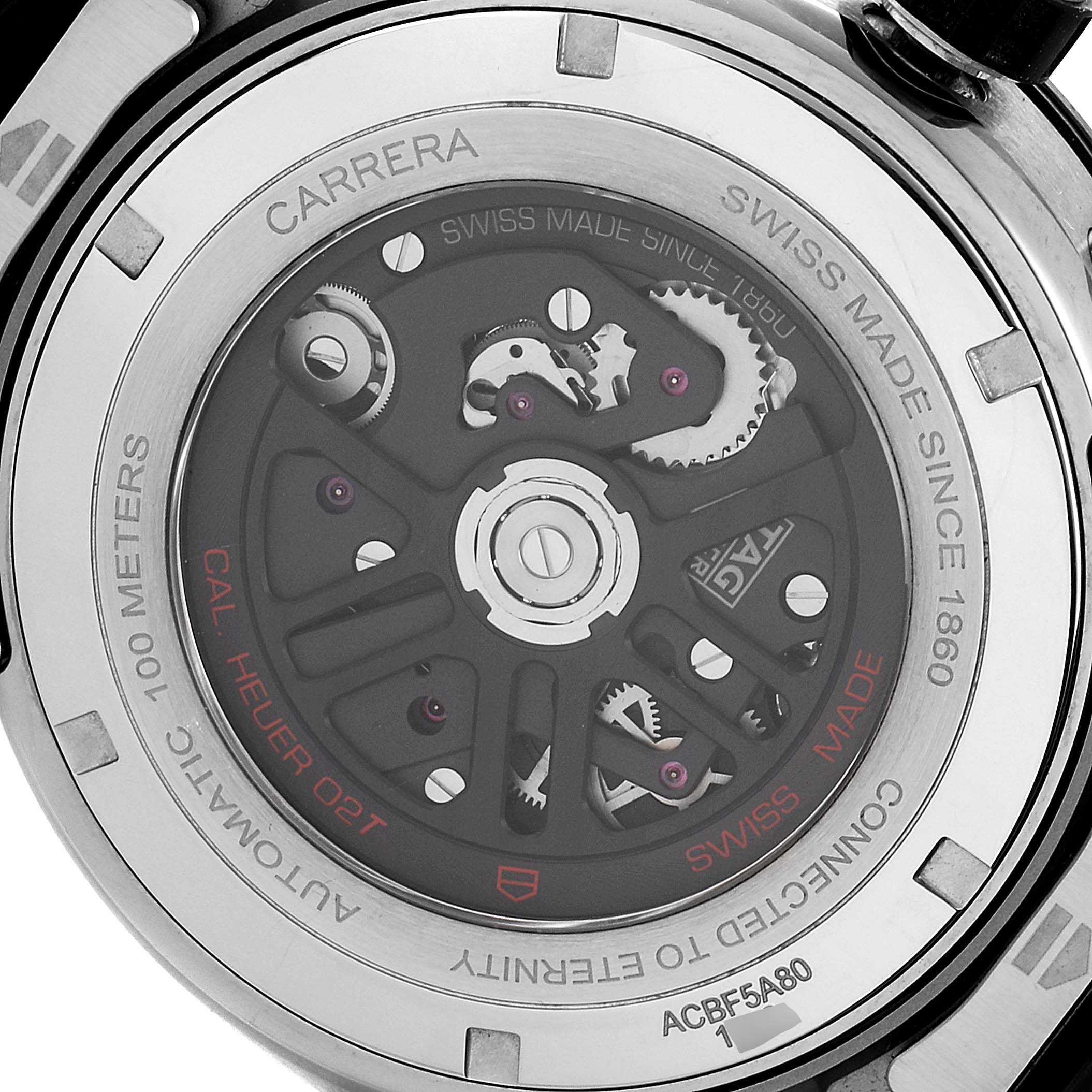 The image shows the back view of a Tag Heuer Carrera ACBF5A80 Men's Titanium Black Dial ACBF5A80 Men's Titanium Black Dial watch, highlighting its intricate movement and "Cal Heuer 02T" inscription.